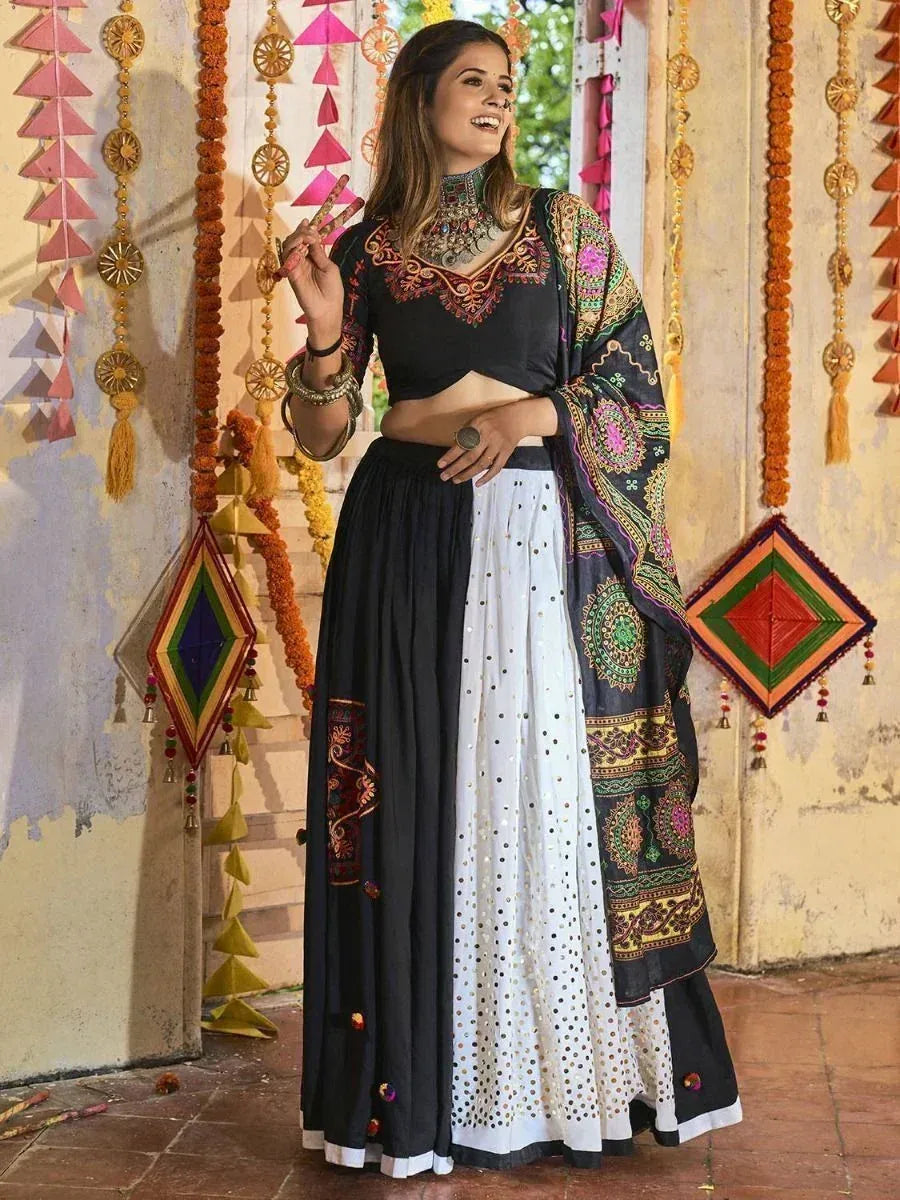 Black and white embroidered lehenga choli with colorful dupatta, festive Indian ethnic wear