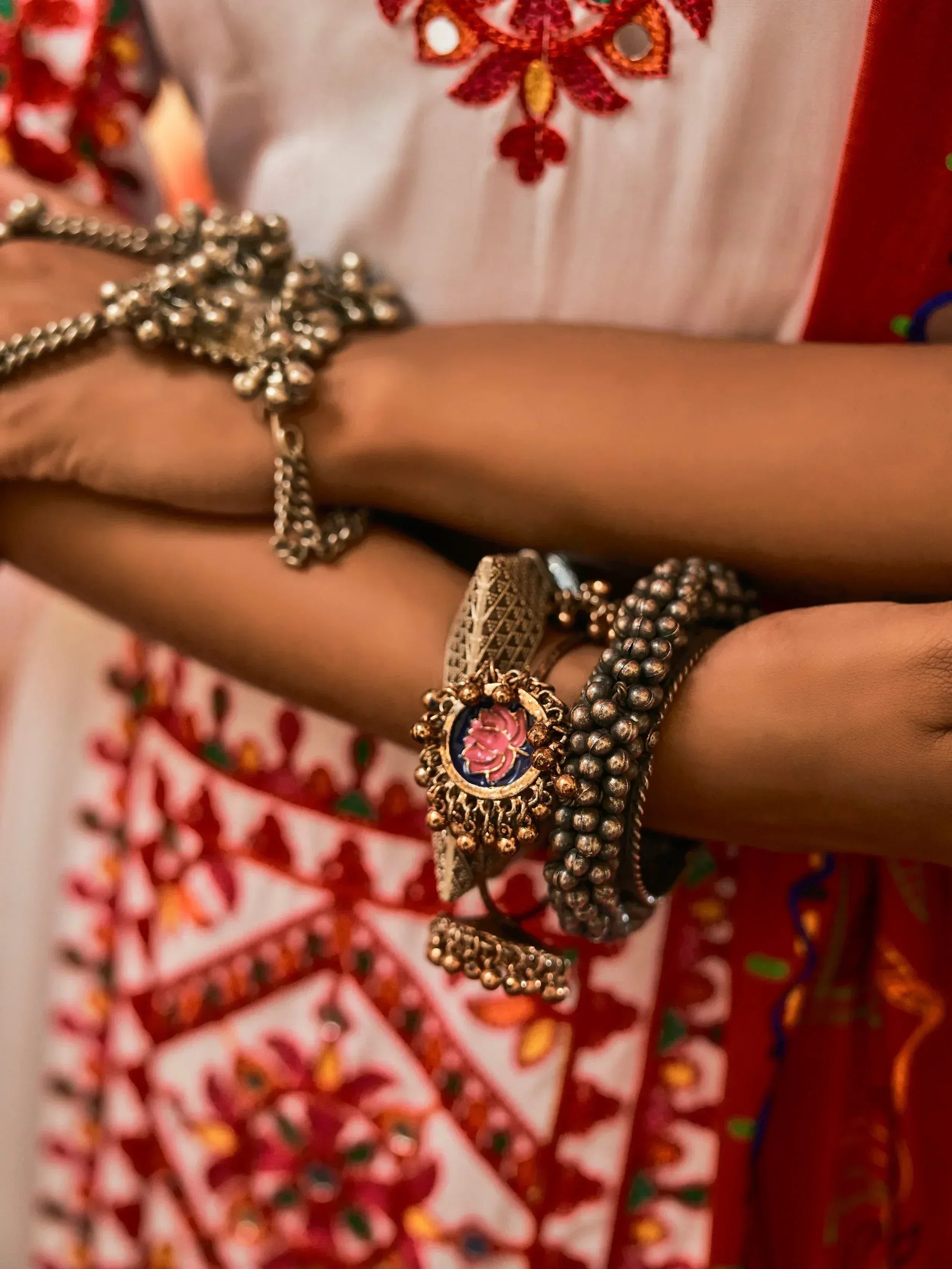 Traditional Indian ethnic wear with mirror work blouse and ornate silver bangles
