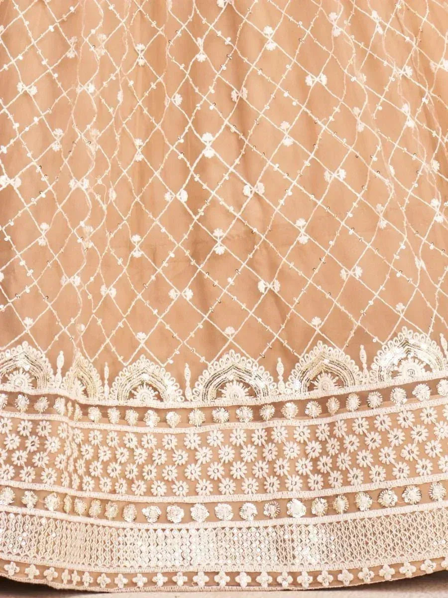 Beige lehenga with intricate white floral embroidery and diamond net pattern, perfect for Indian ethnic wear.