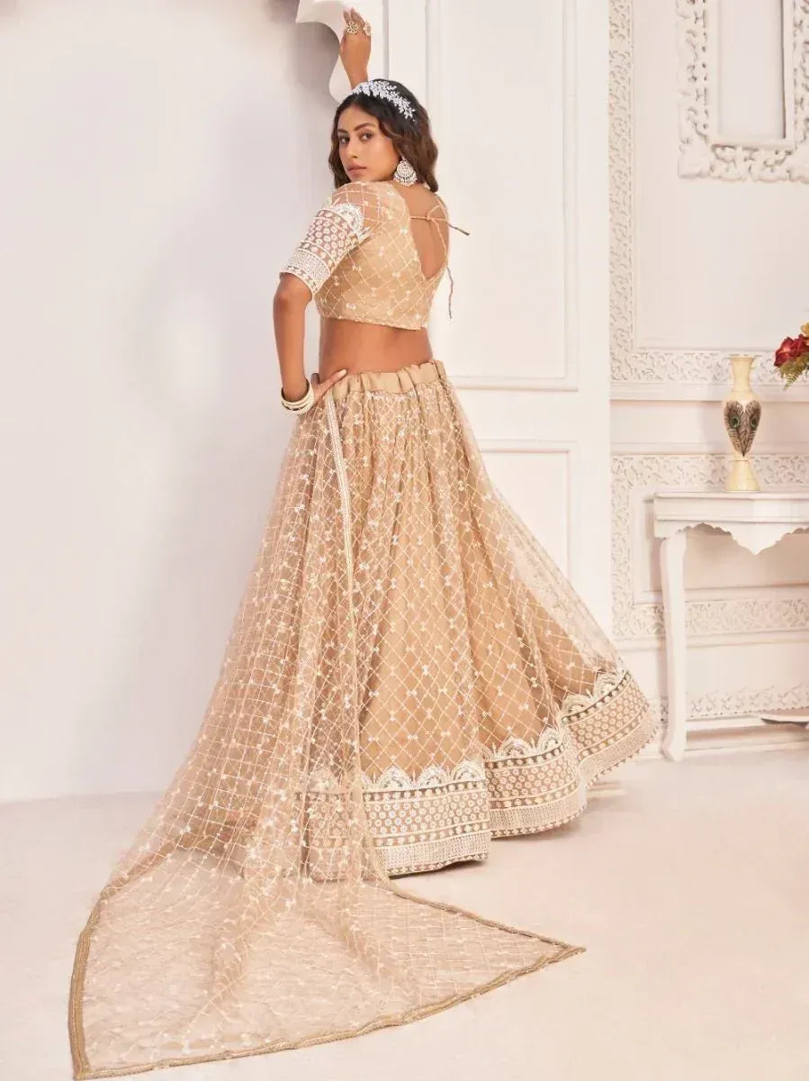 Beige designer lehenga choli with net dupatta, perfect for Indian weddings and festive occasions