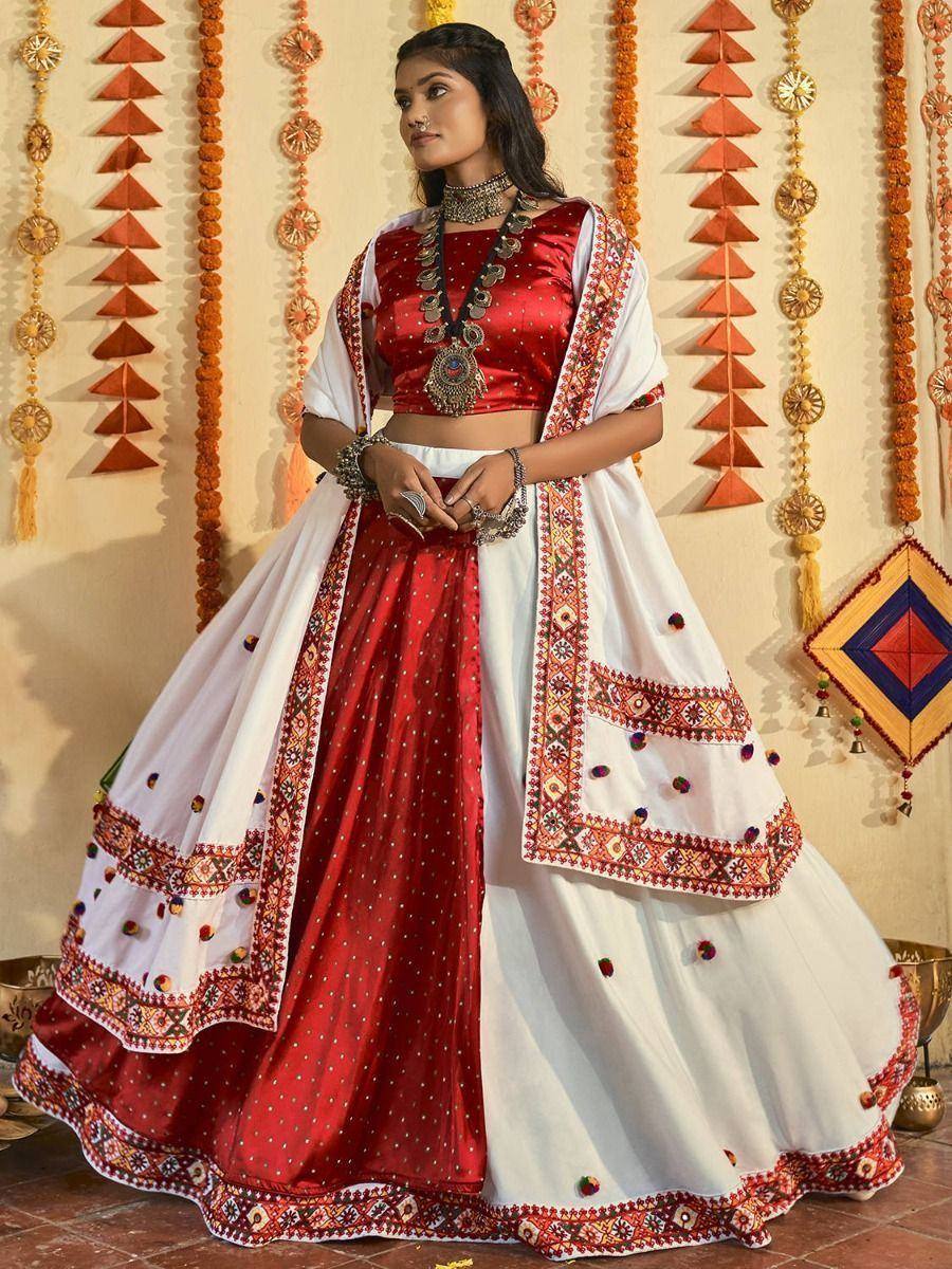 Red and white embroidered lehenga choli with mirror work, perfect for Indian ethnic occasions