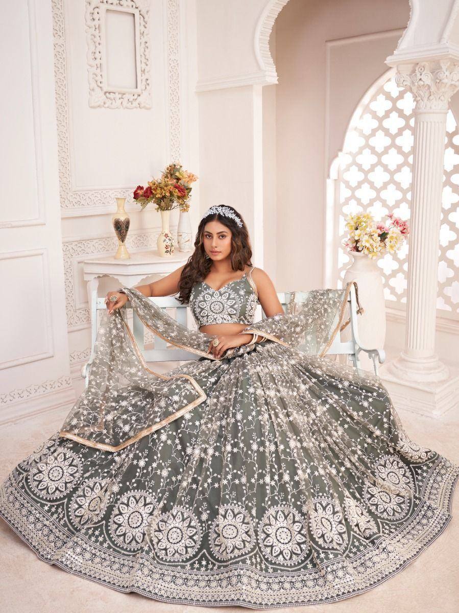 Elegant grey lehenga choli with intricate white embroidery, perfect for Indian weddings and festive occasions.