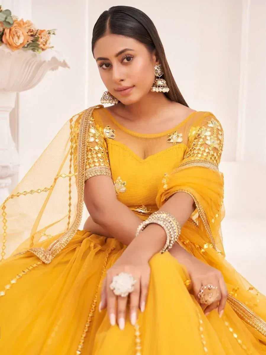 Yellow designer lehenga choli with gold embroidery and dupatta, perfect for Indian ethnic occasions
