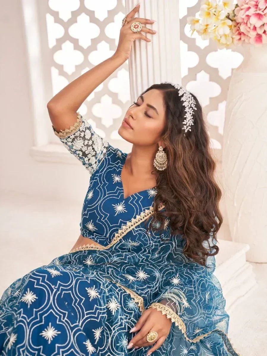 Blue embroidered lehenga choli with gold detailing, perfect for Indian ethnic wear occasions