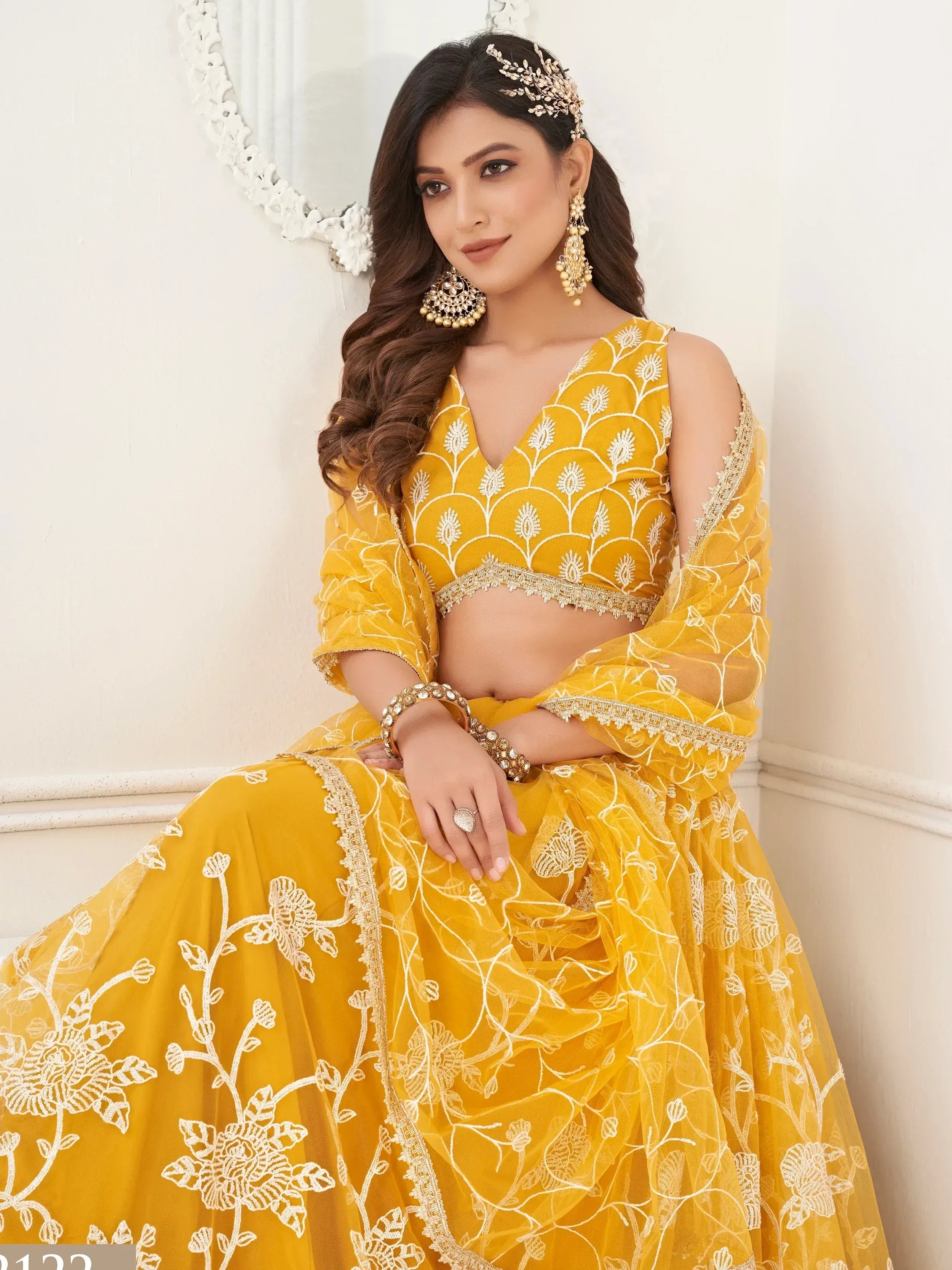 Yellow embroidered lehenga choli with floral design, perfect for Indian ethnic wear occasions