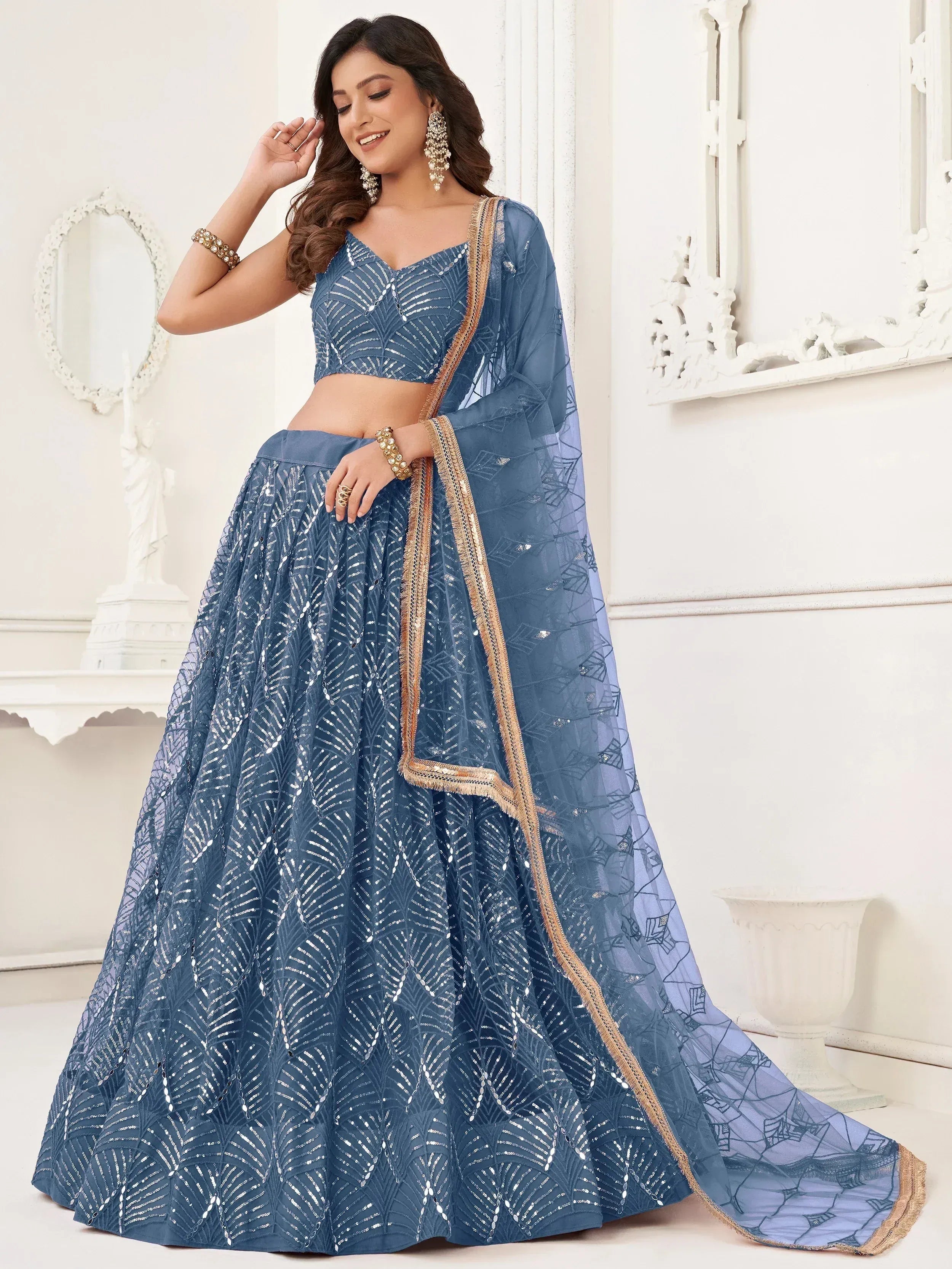Blue sequin lehenga choli with gold trim, perfect for Indian ethnic wear and festive occasions