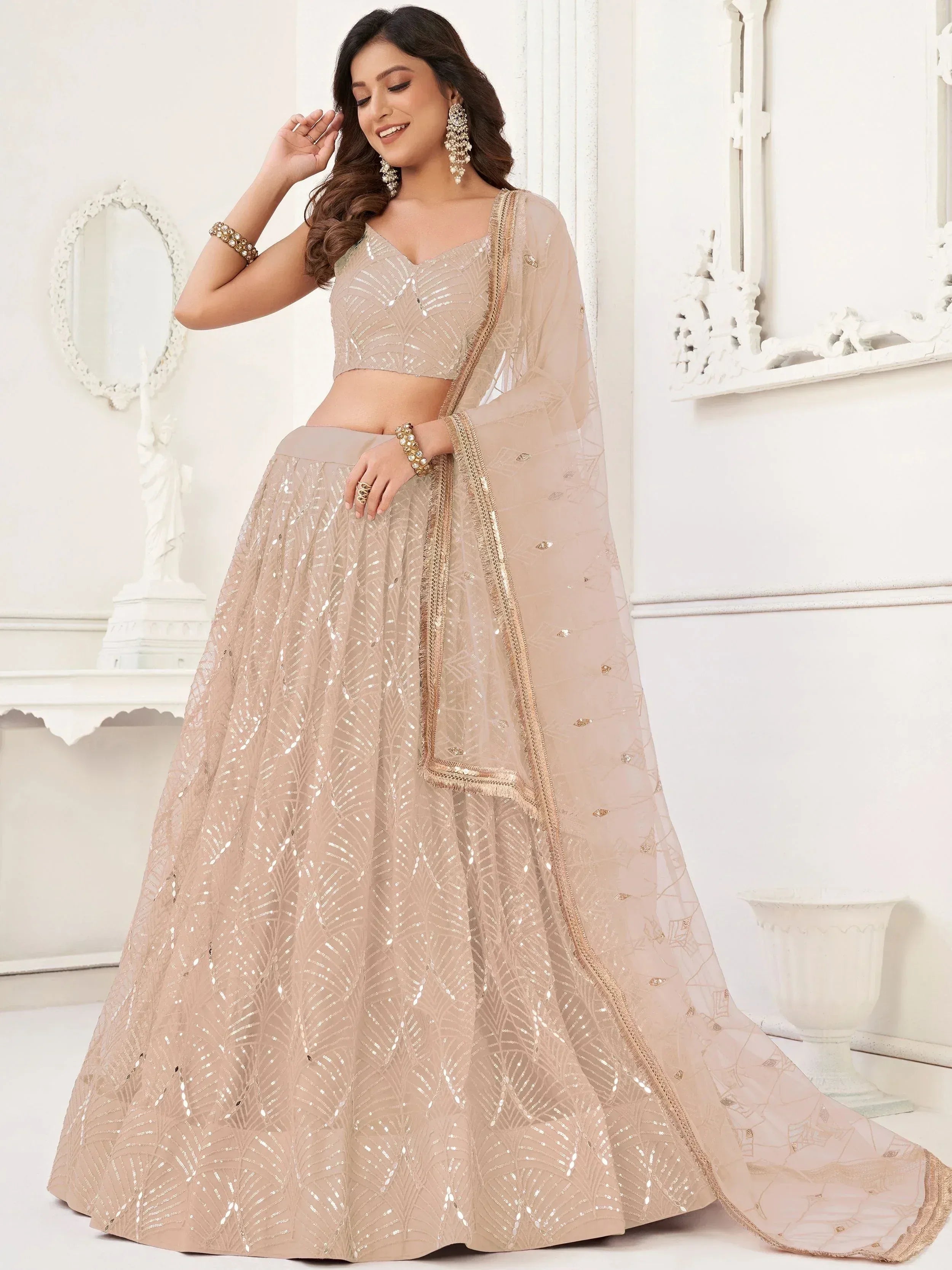 Captivating Beige Embroidered Net Engagement Wear Lehenga Choli