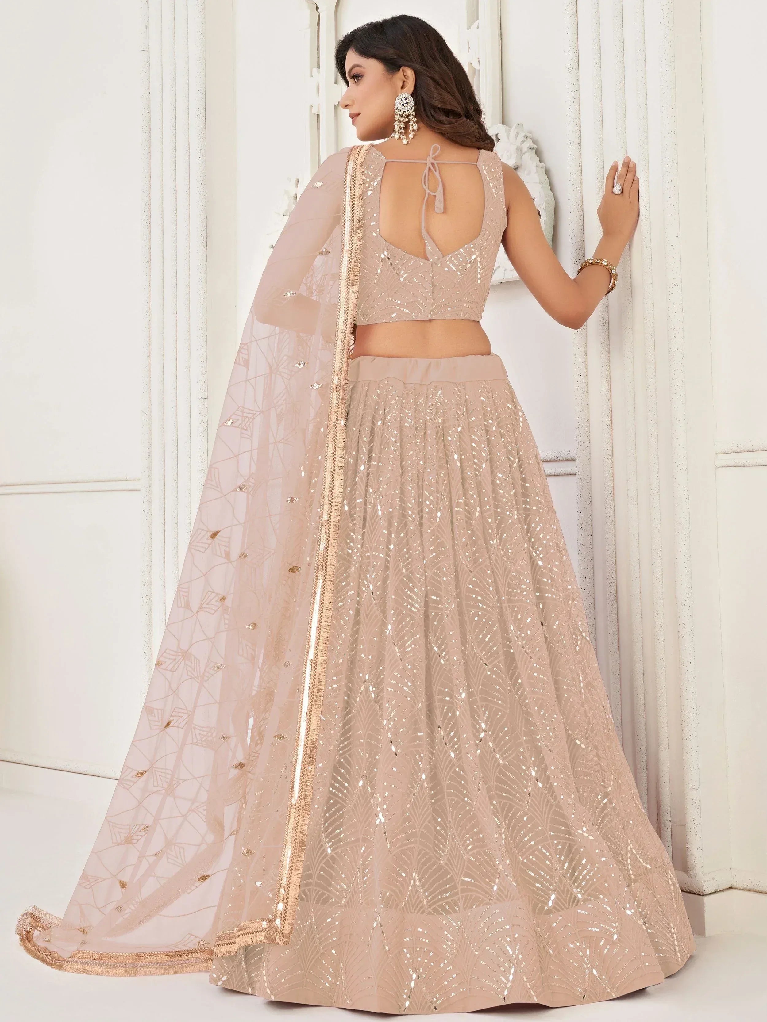 Captivating Beige Embroidered Net Engagement Wear Lehenga Choli