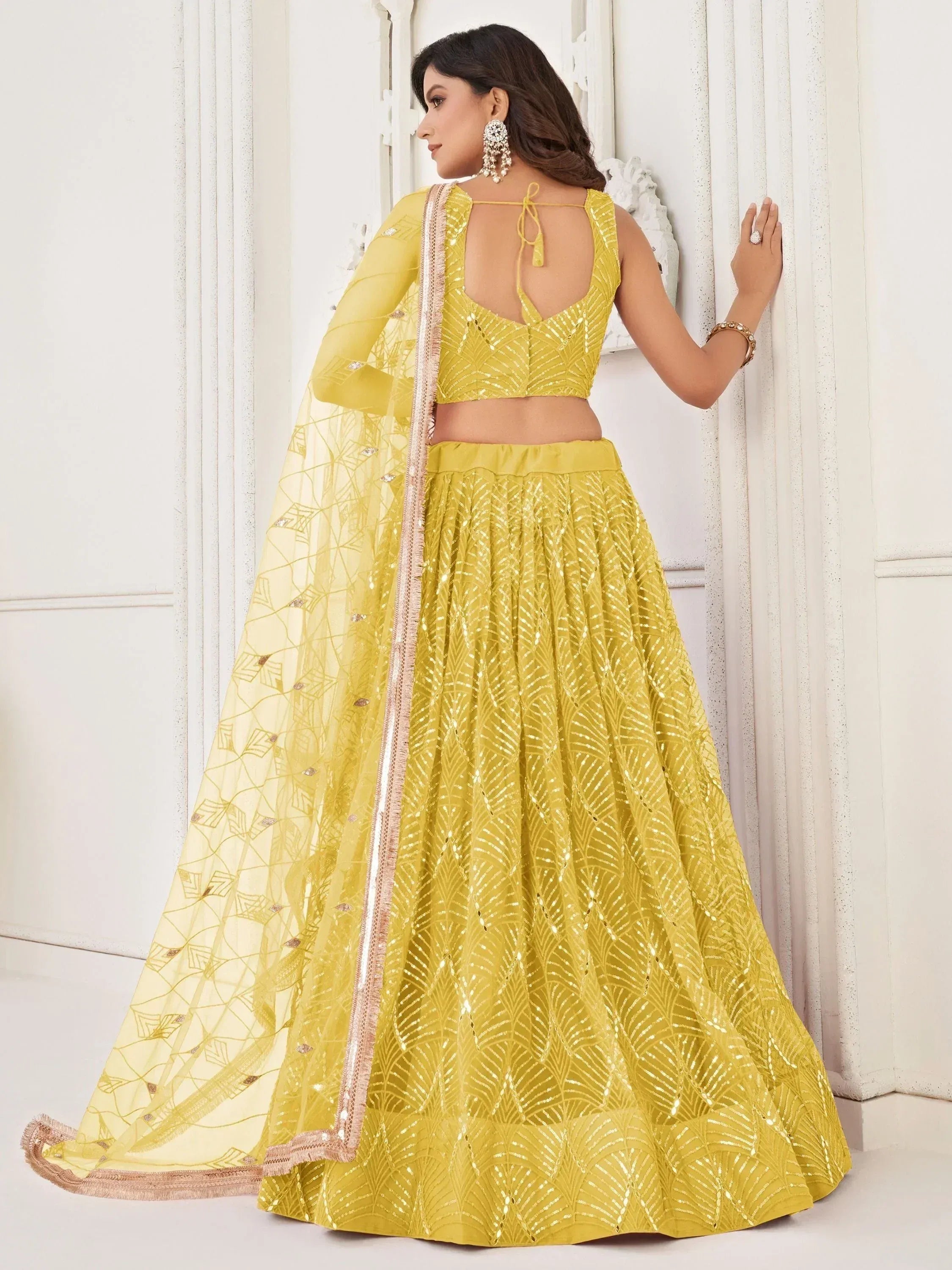 Yellow sequin lehenga choli with backless blouse and sheer dupatta, Indian ethnic wear