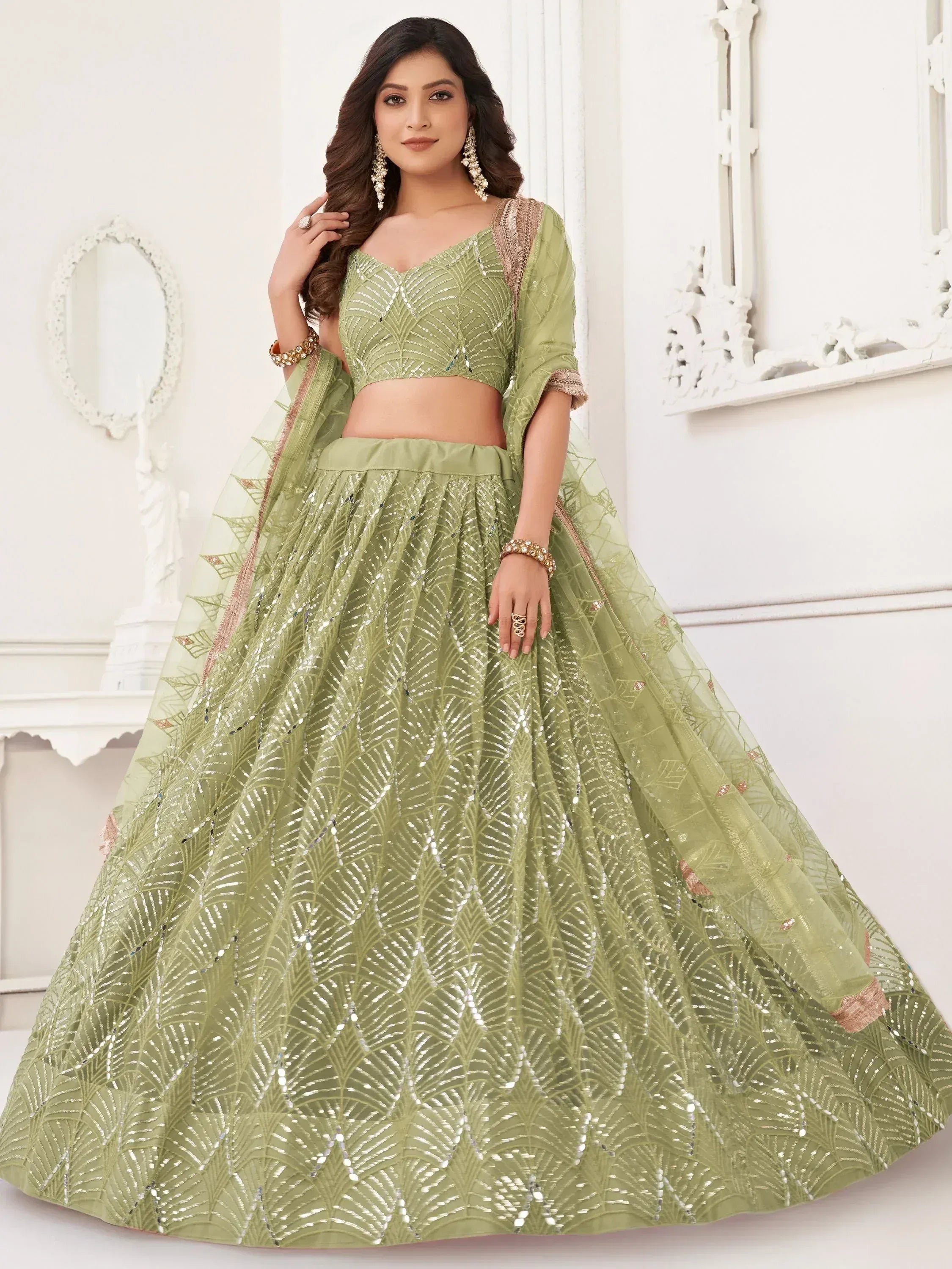 Elegant green designer lehenga choli with sequin embroidery and sheer dupatta for Indian ethnic wear