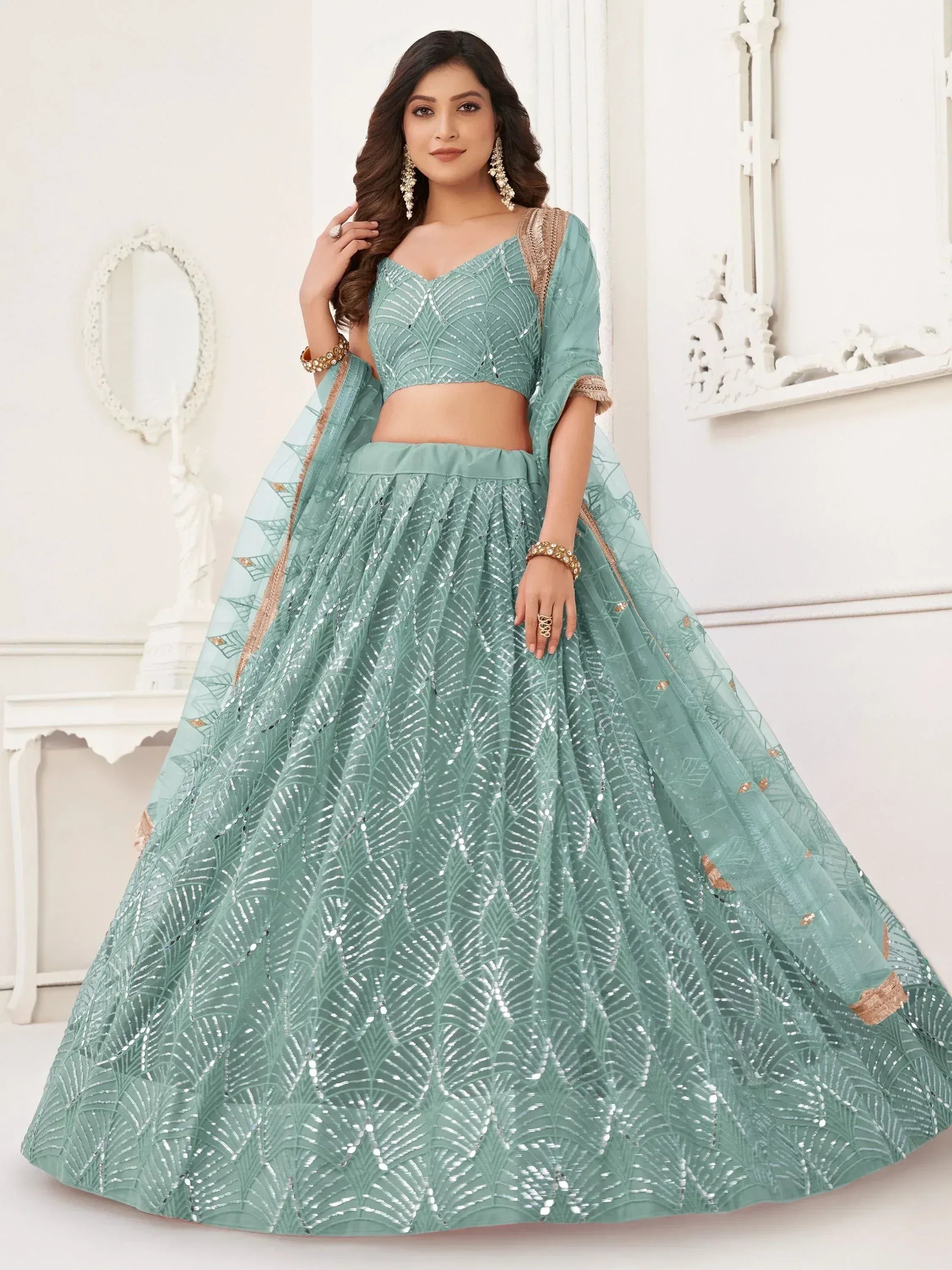 Mint green designer lehenga choli with sequin leaf pattern, perfect for weddings and festive occasions