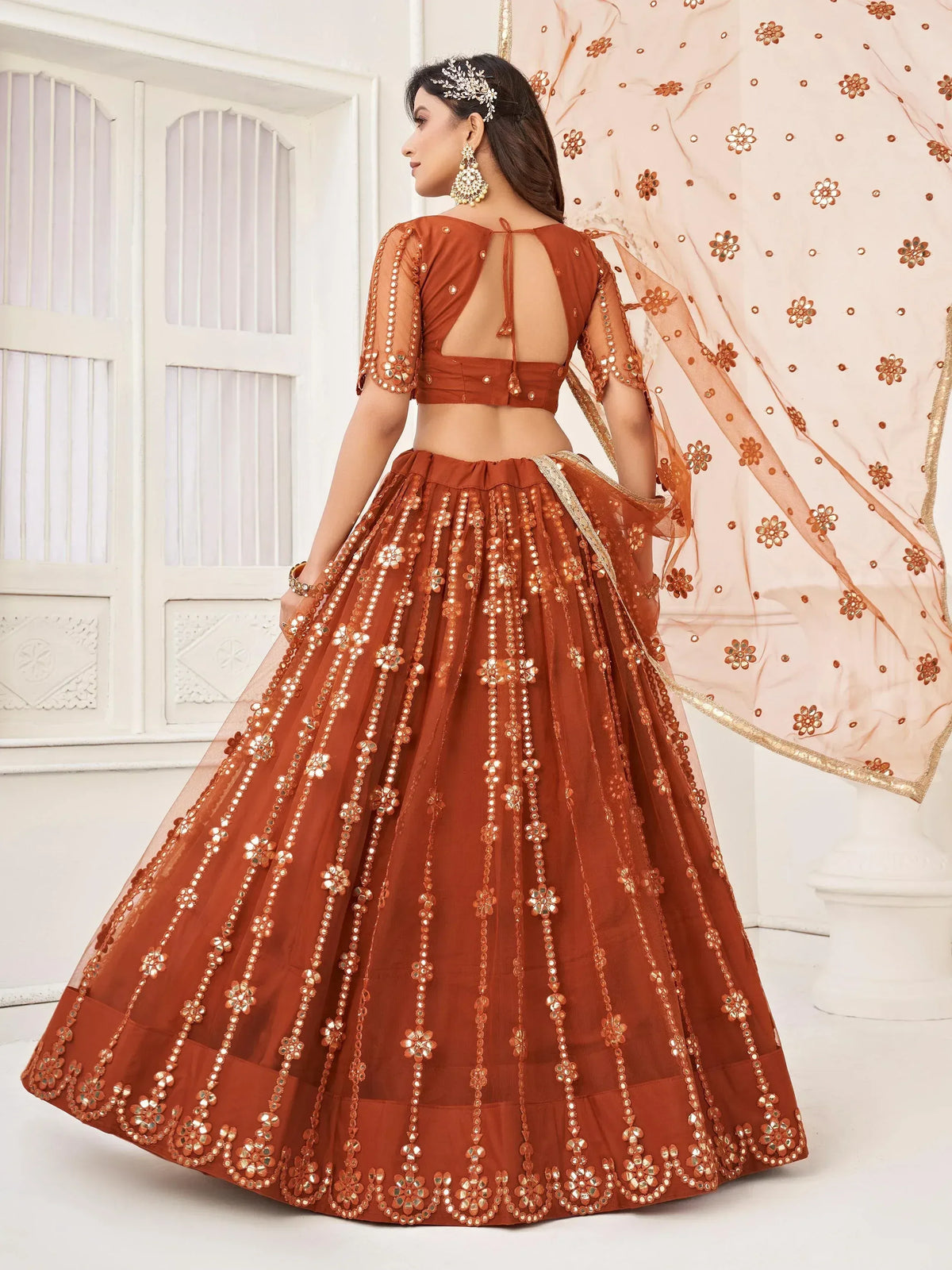 Elegant brown lehenga choli with mirror work and floral dupatta for Indian ethnic wear