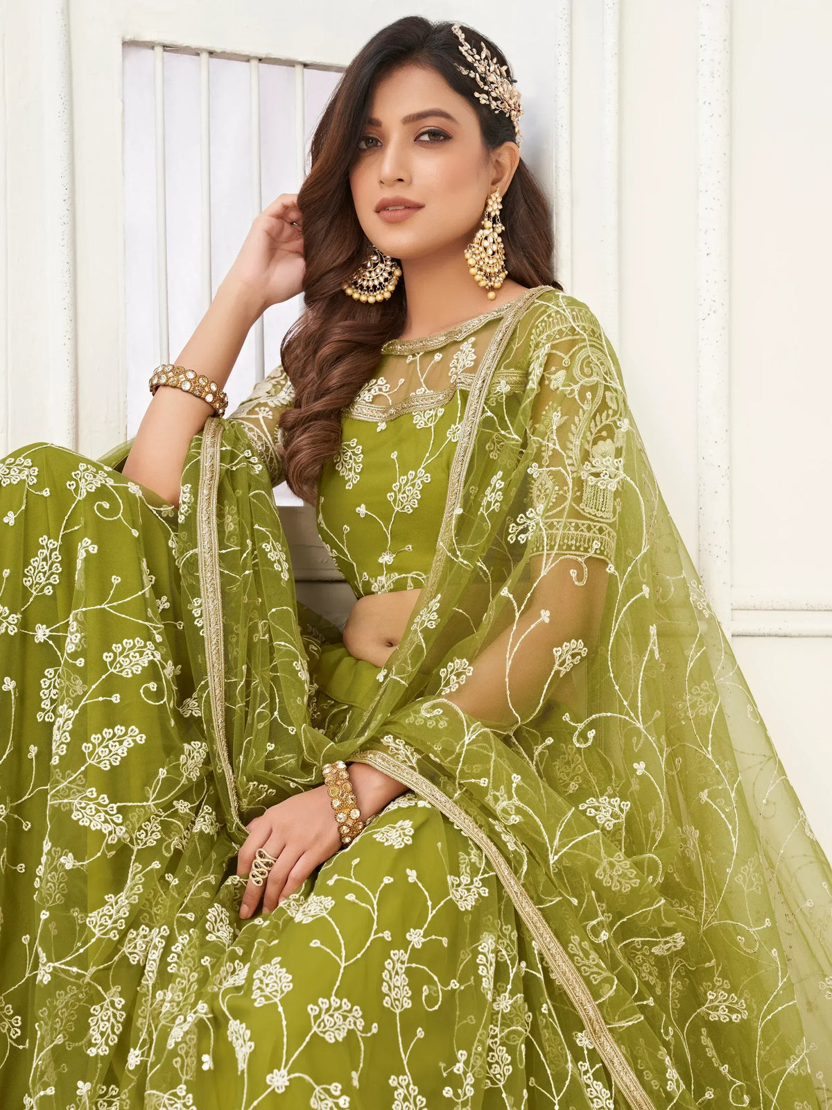 Olive green embroidered lehenga choli with floral net dupatta, perfect for Indian ethnic wear