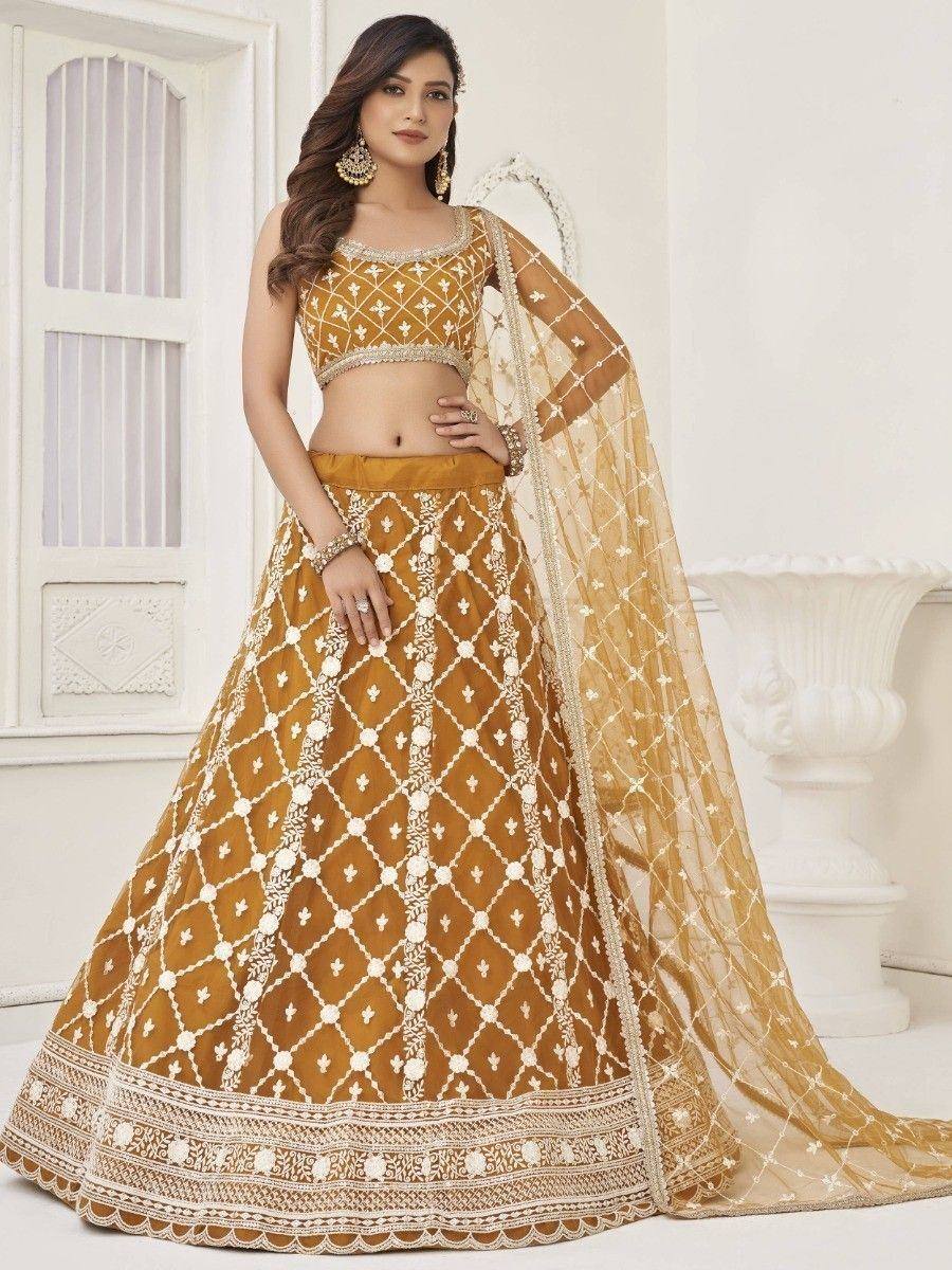 Mustard yellow lehenga choli with white embroidery, perfect for Indian weddings and festive occasions