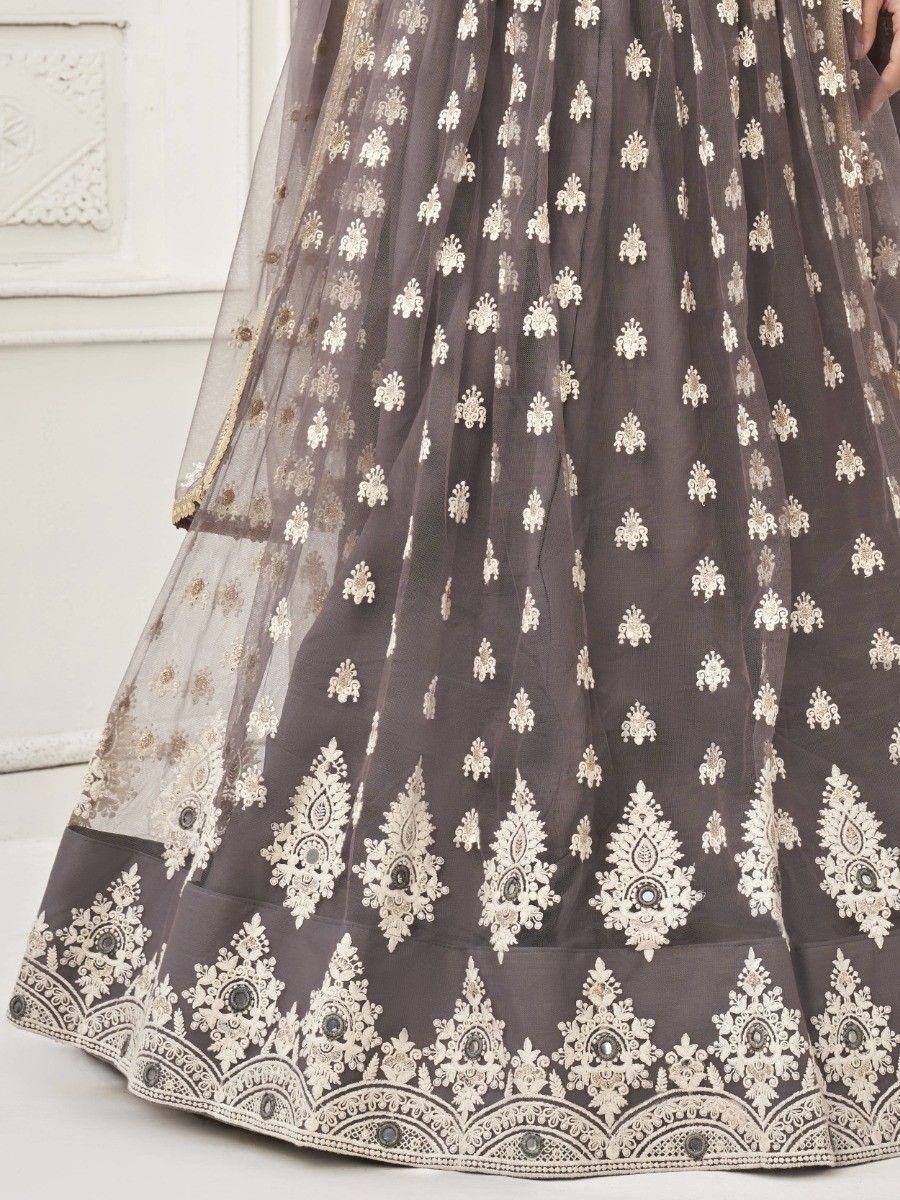 Grey lehenga with intricate white floral embroidery and detailed border, perfect for Indian ethnic wear.