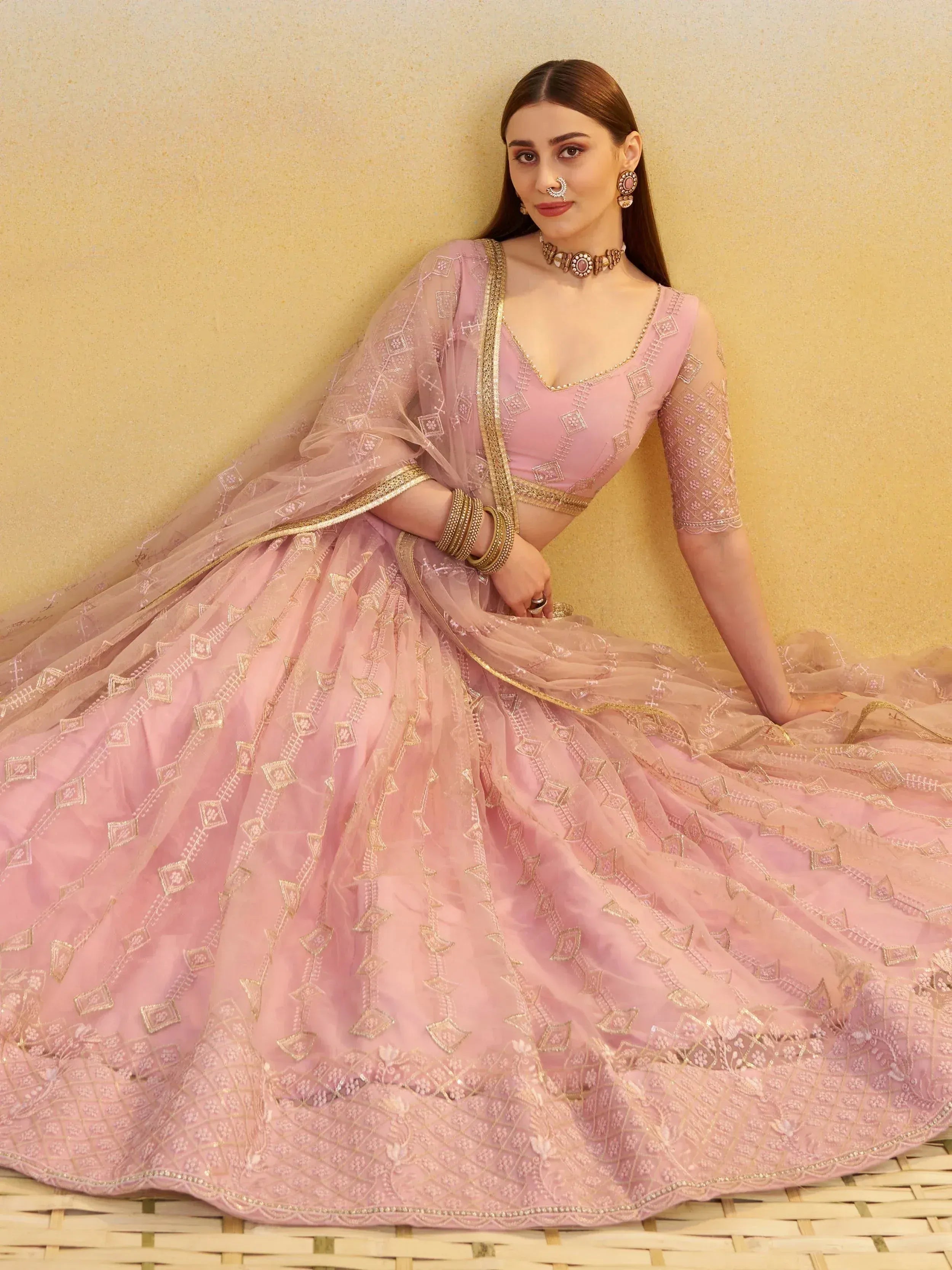 Pink designer lehenga choli with gold embroidery, perfect for Indian ethnic wear and weddings