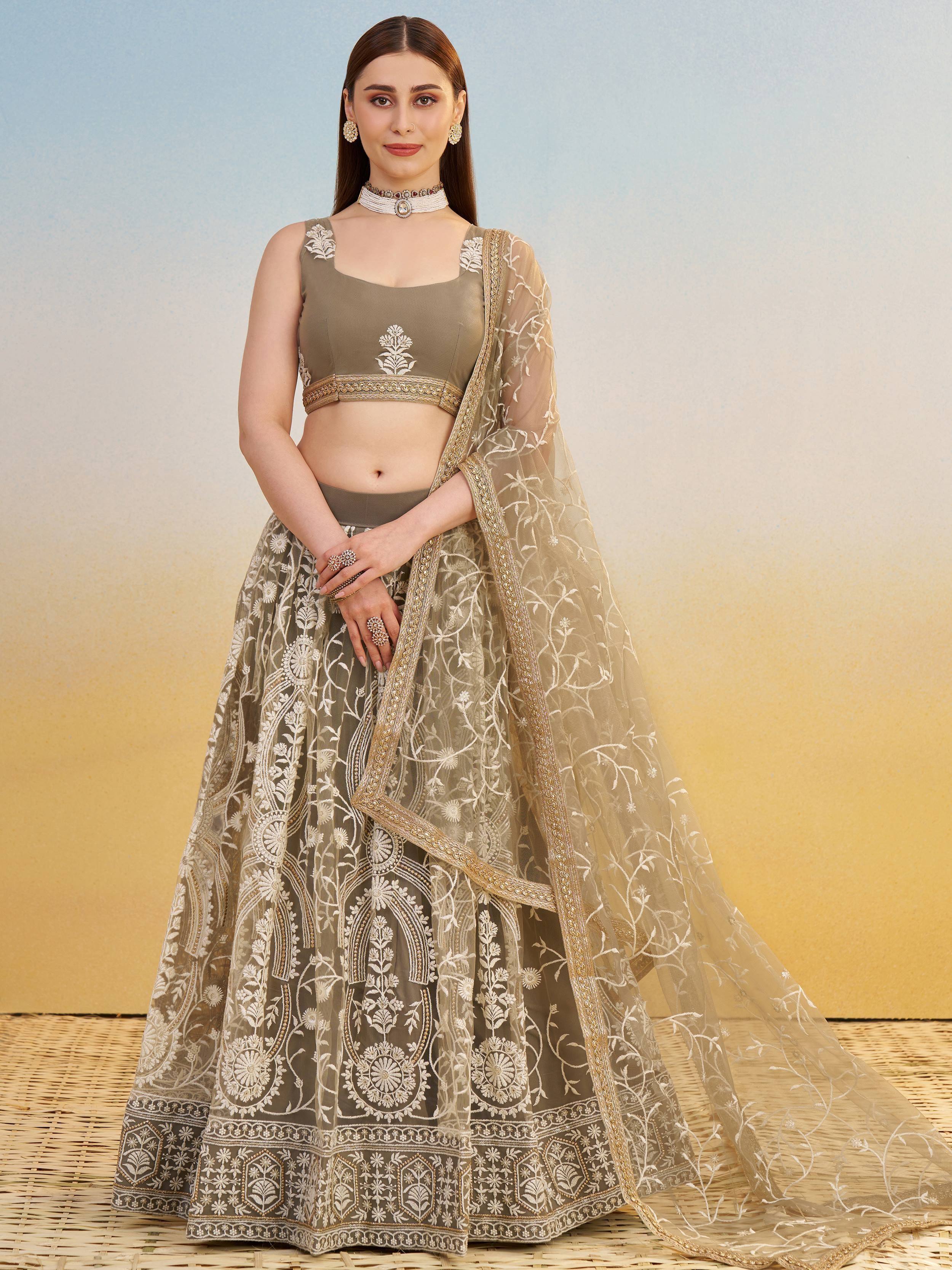 Olive green embroidered lehenga choli with floral motifs and sheer dupatta, perfect for Indian ethnic wear.
