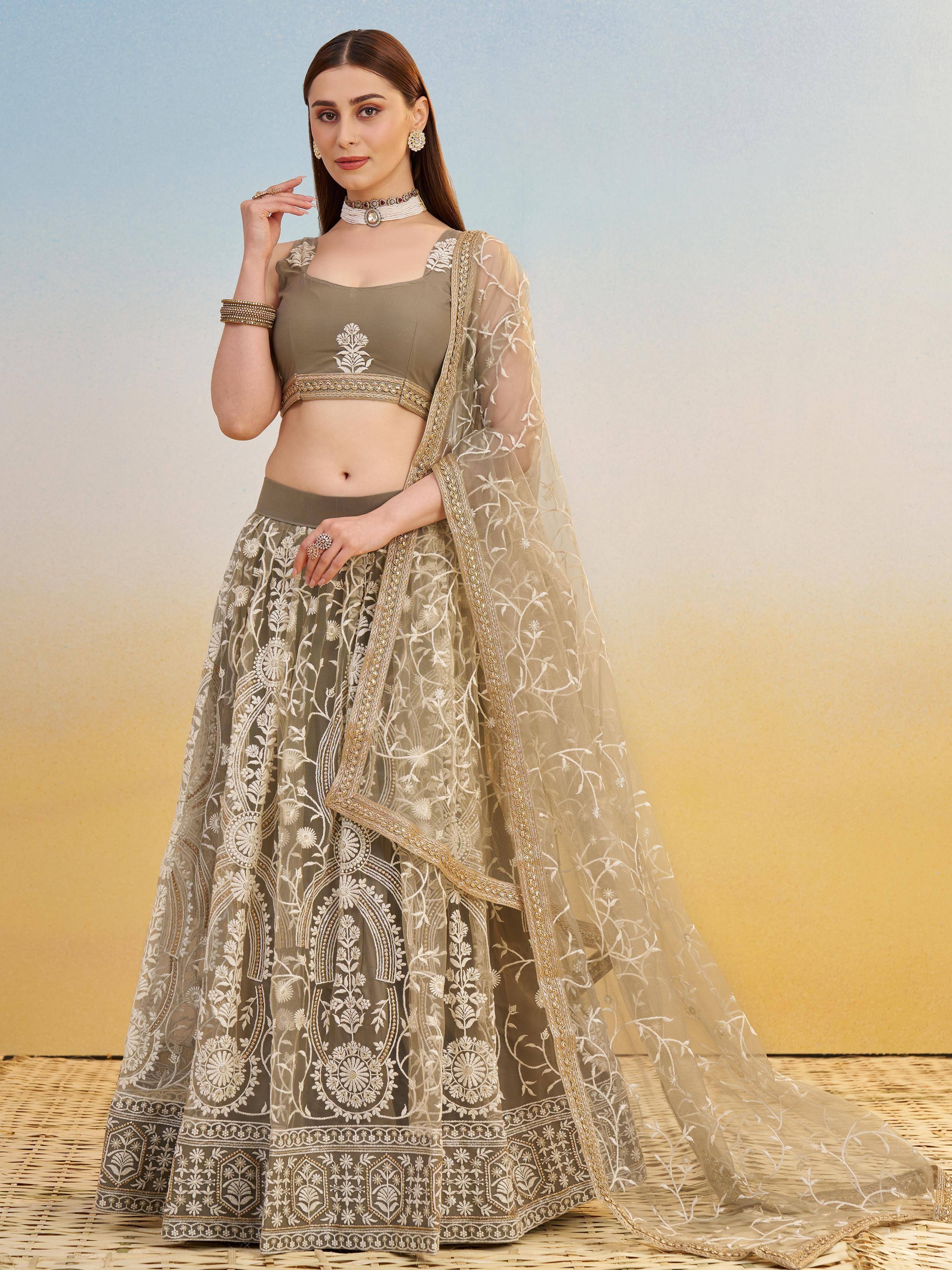 Elegant olive green lehenga choli with white floral embroidery and sheer dupatta, perfect for Indian ethnic wear.