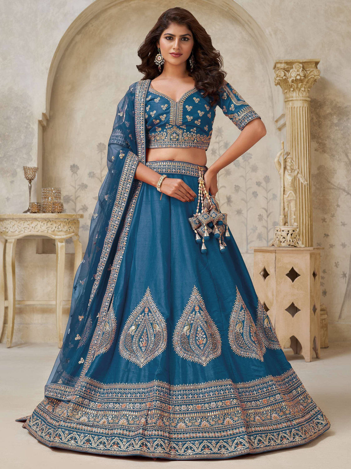 Blue embroidered lehenga choli with gold detailing, perfect for Indian weddings and festive occasions