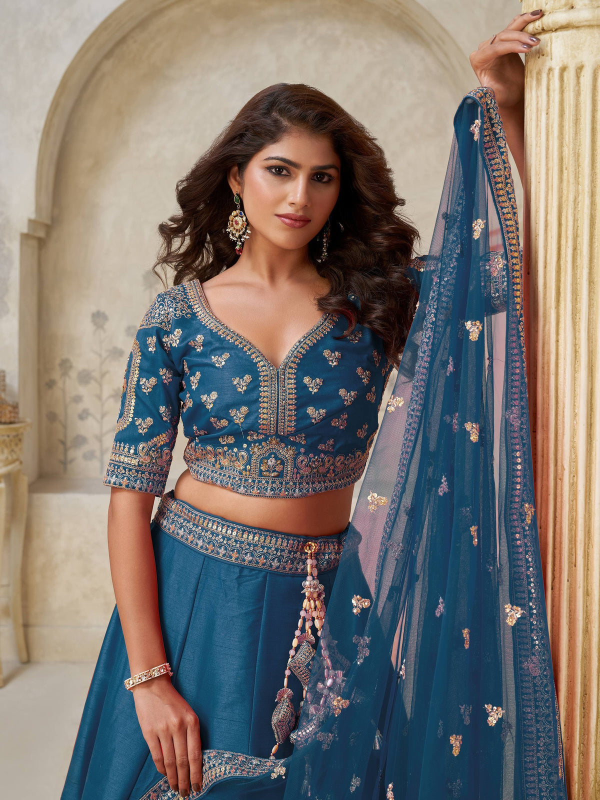 Teal blue embroidered lehenga choli with dupatta, perfect for Indian ethnic wear and festive occasions.