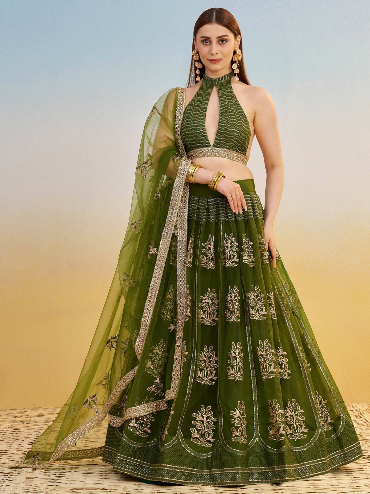 Green embroidered lehenga choli with halter neck blouse and sheer dupatta, Indian ethnic wear