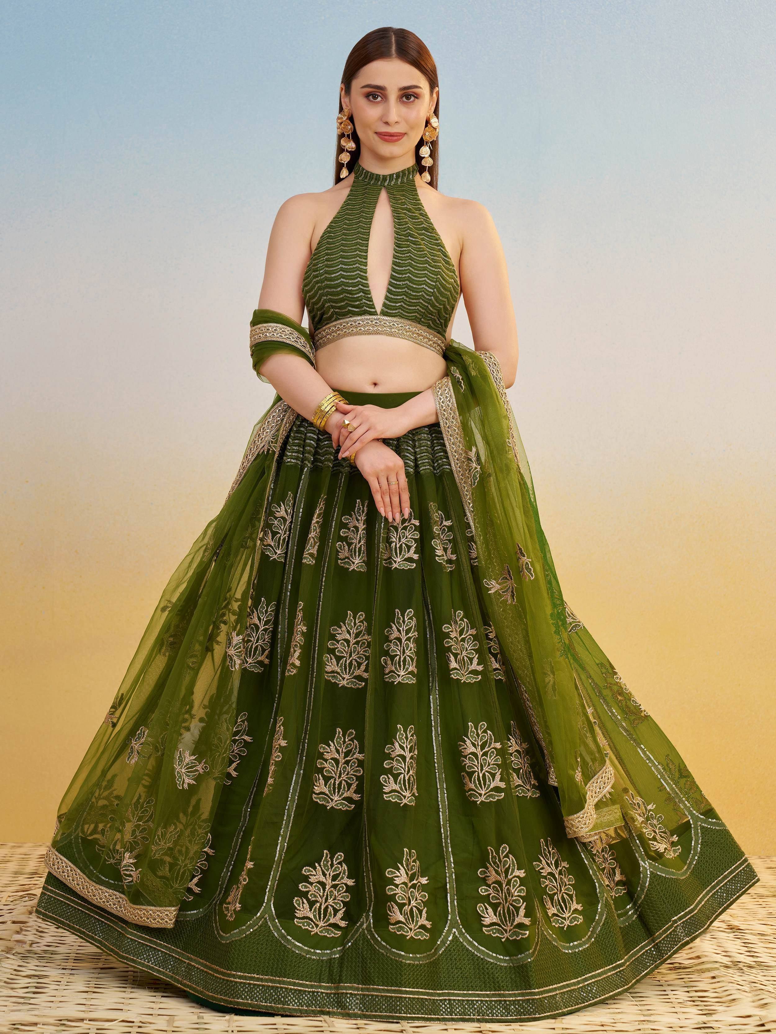 Green embroidered lehenga choli with halter neck blouse, perfect for Indian ethnic wear occasions