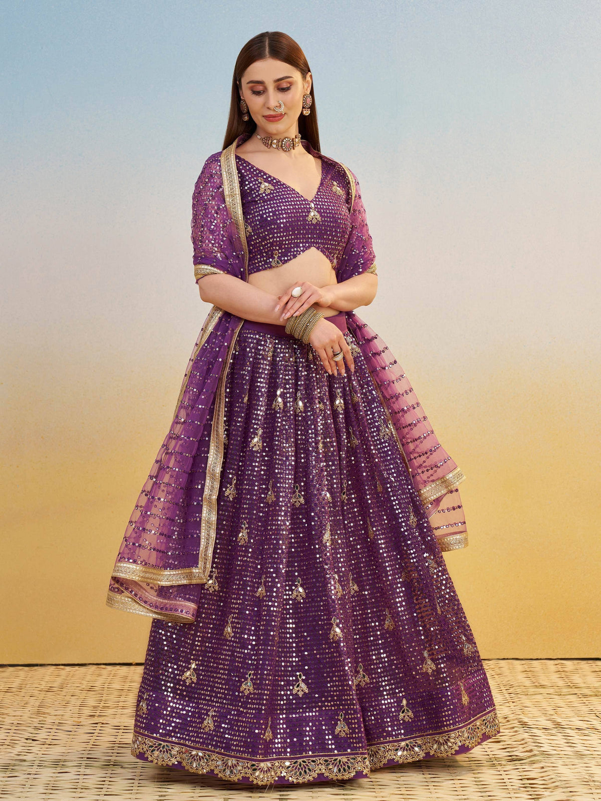 Purple sequin lehenga choli with gold embroidery, perfect for Indian weddings and festive occasions.