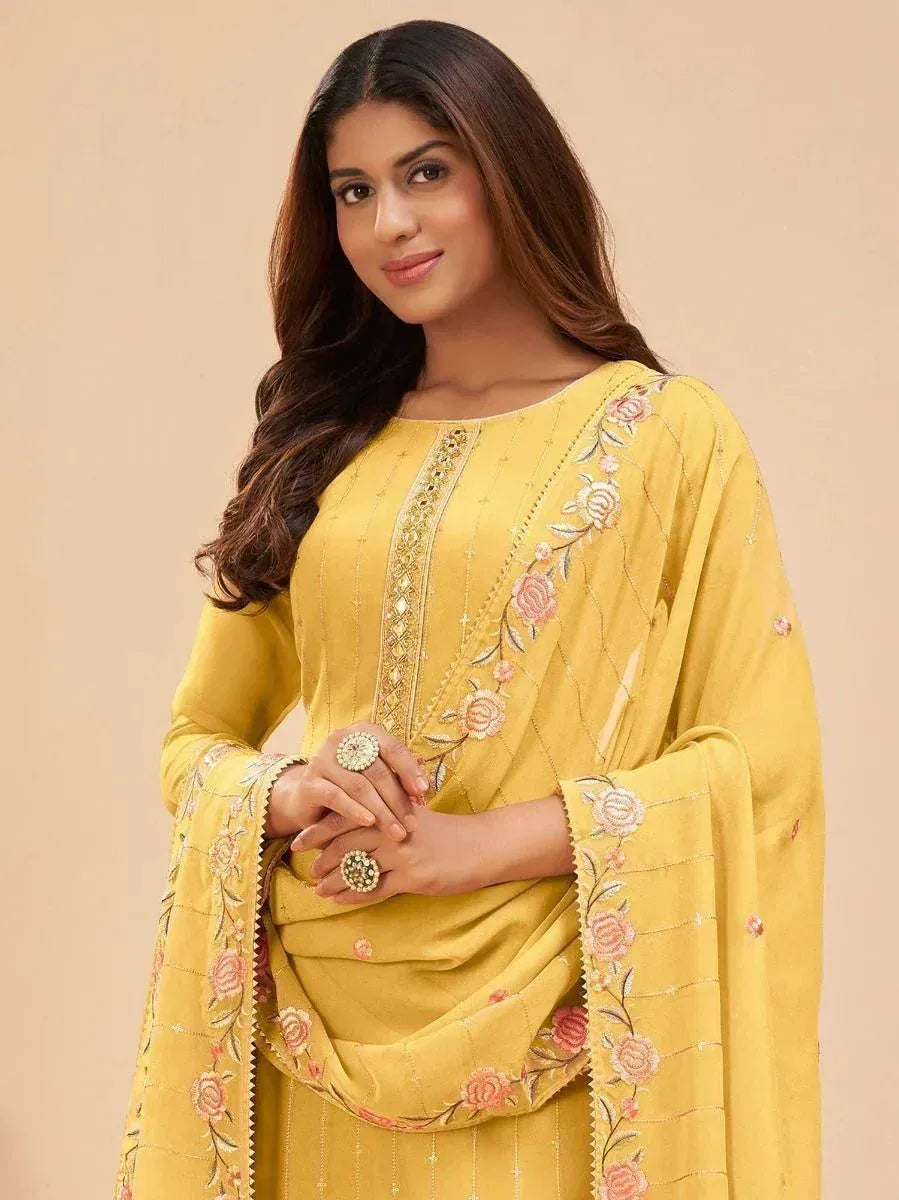 Yellow embroidered salwar kameez with floral detailing, perfect for ethnic occasions