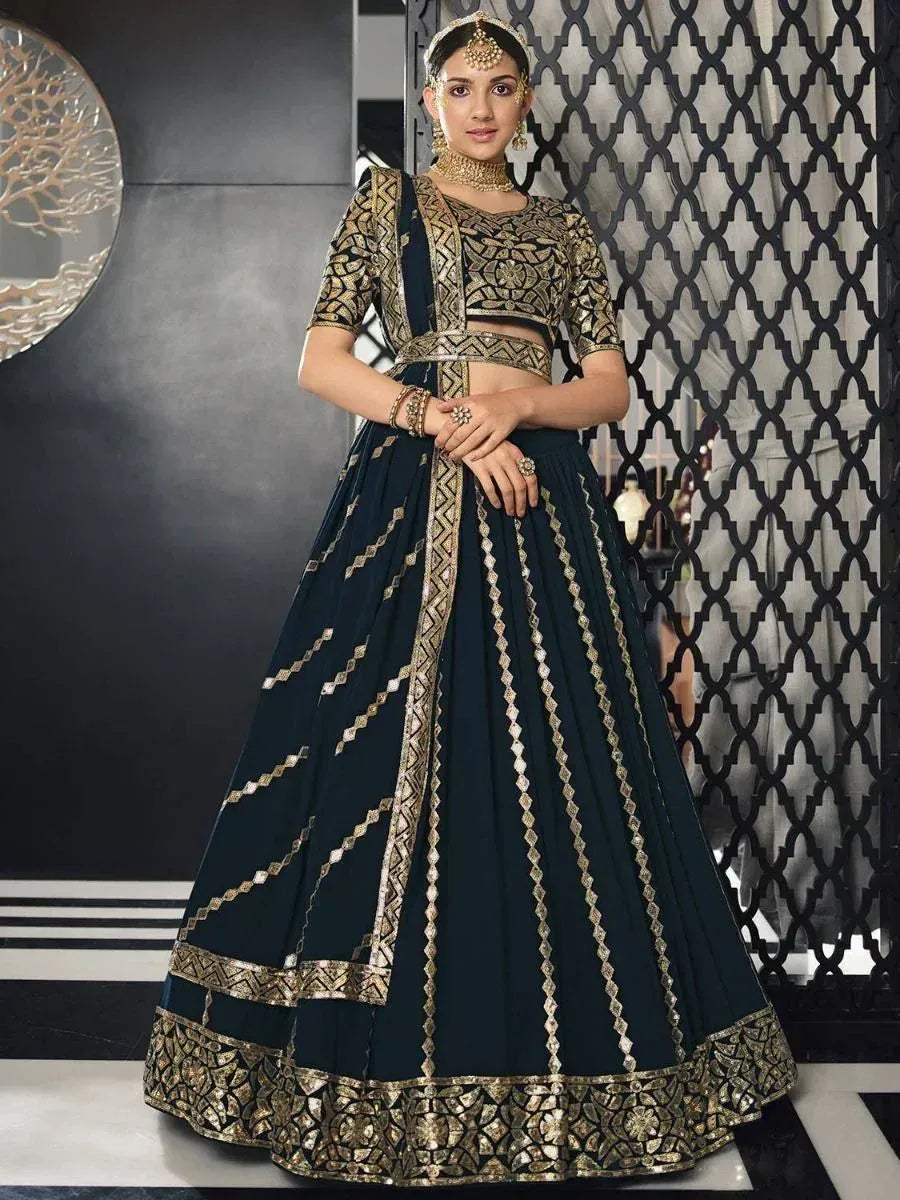 Elegant navy blue lehenga choli with gold embroidery, perfect for Indian ethnic occasions and weddings.