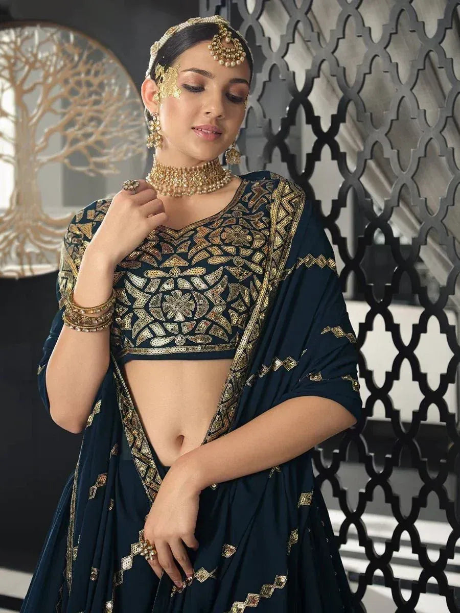 Elegant navy blue lehenga choli with gold embroidery, perfect for Indian ethnic wear and festive occasions.