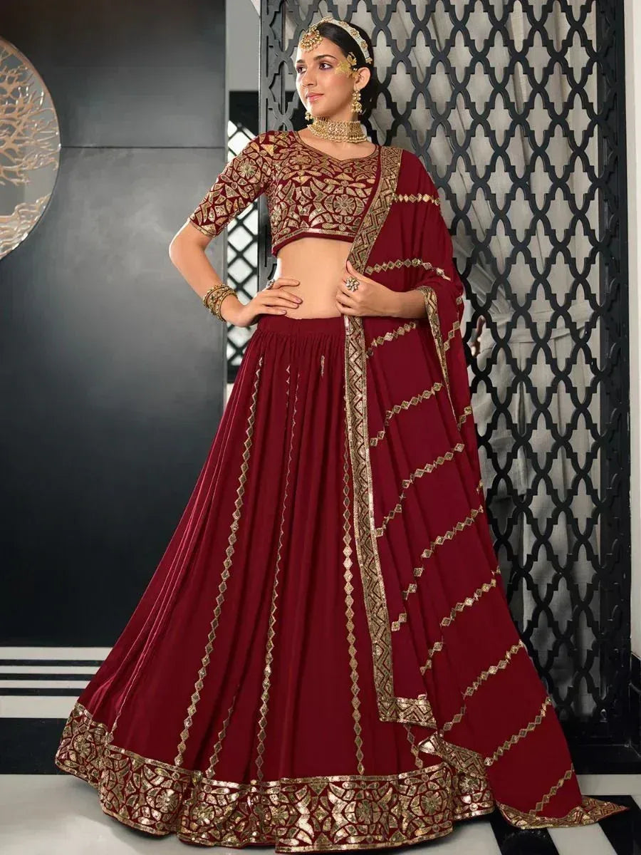 Maroon designer lehenga choli with gold embroidery, perfect for weddings and festive occasions