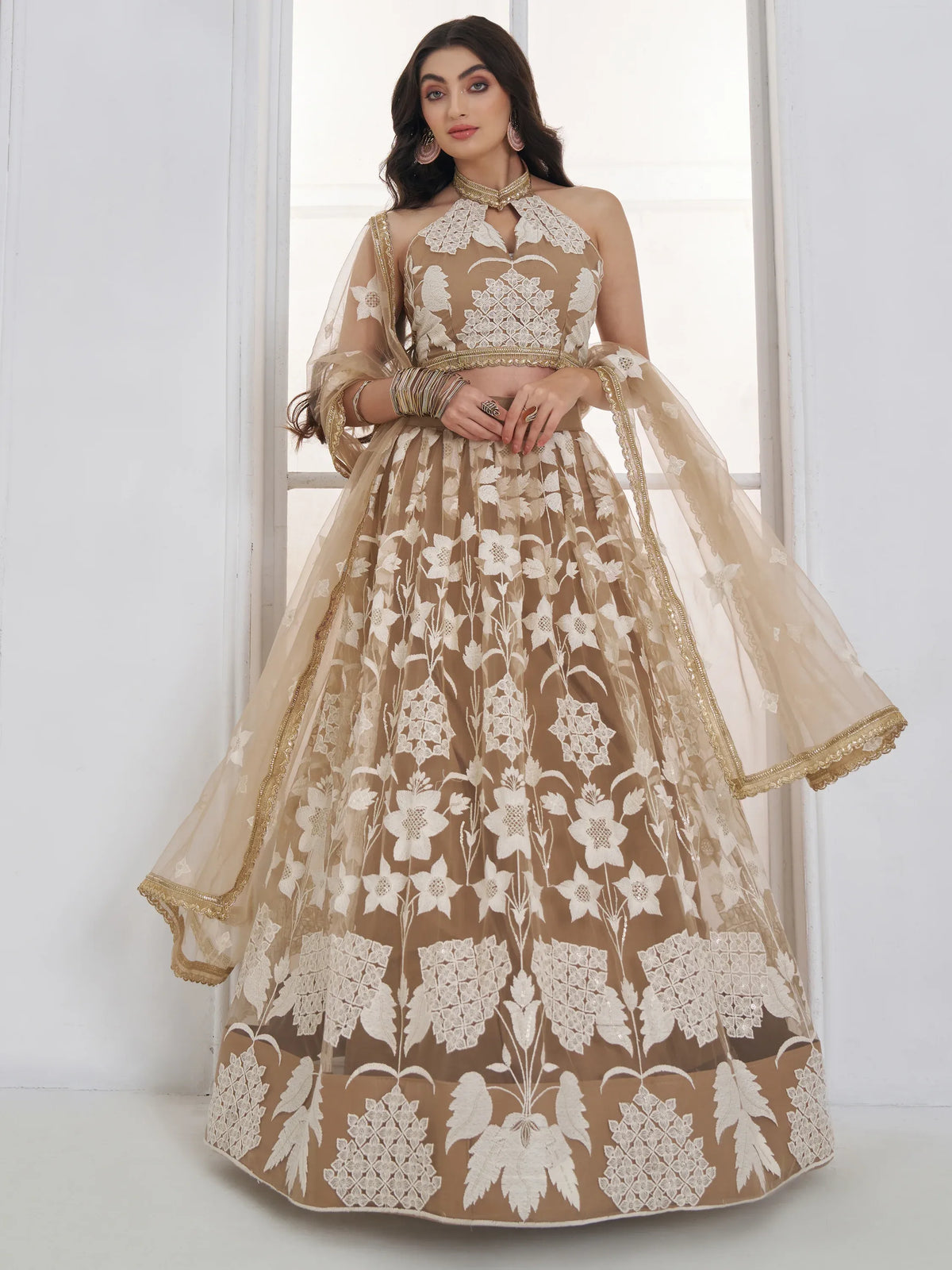 Dazzling Beige Embroidered Net Marriage Wear Lehenga With Blouse