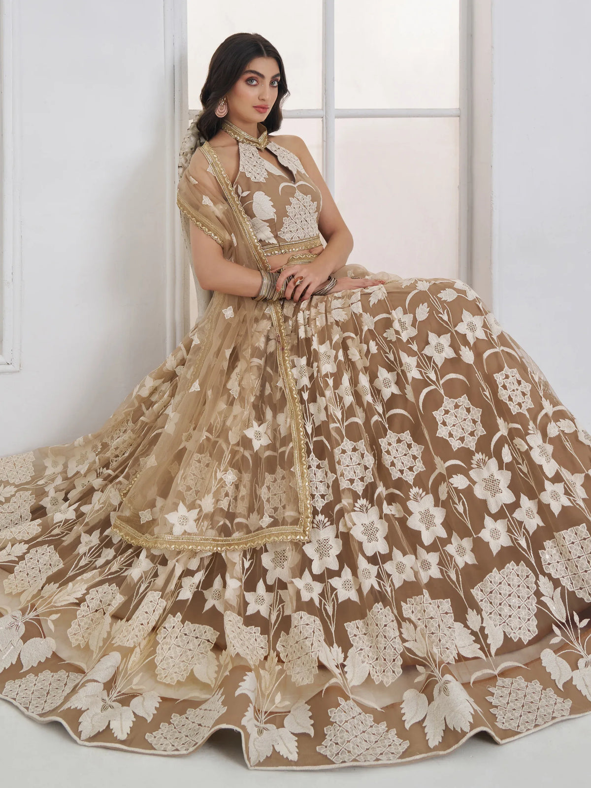 Dazzling Beige Embroidered Net Marriage Wear Lehenga With Blouse