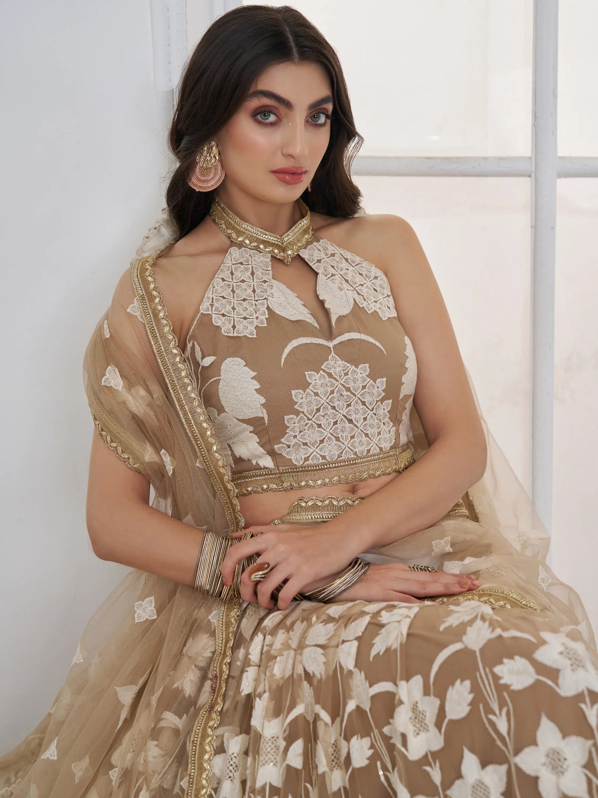 Dazzling Beige Embroidered Net Marriage Wear Lehenga With Blouse