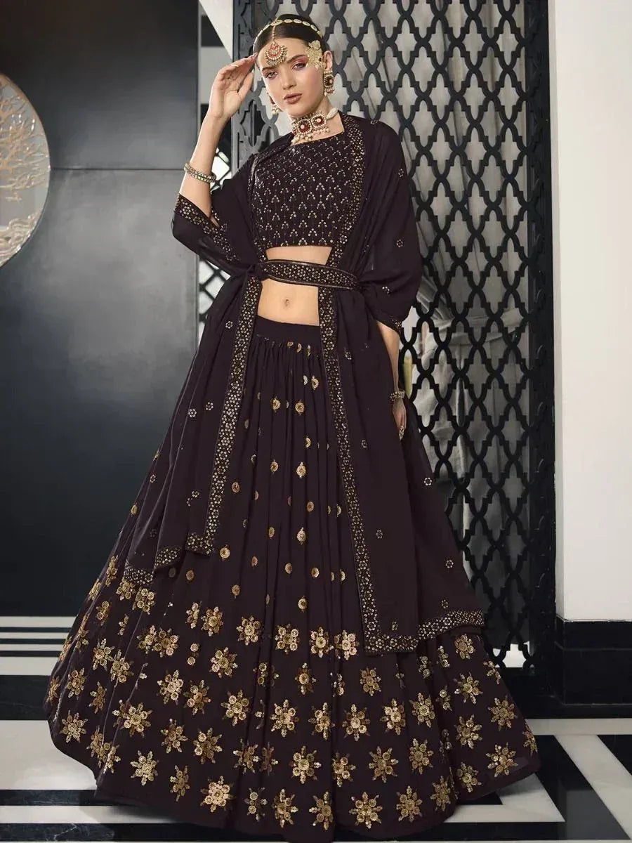 Black embroidered lehenga choli with gold floral motifs, perfect for Indian ethnic wear occasions
