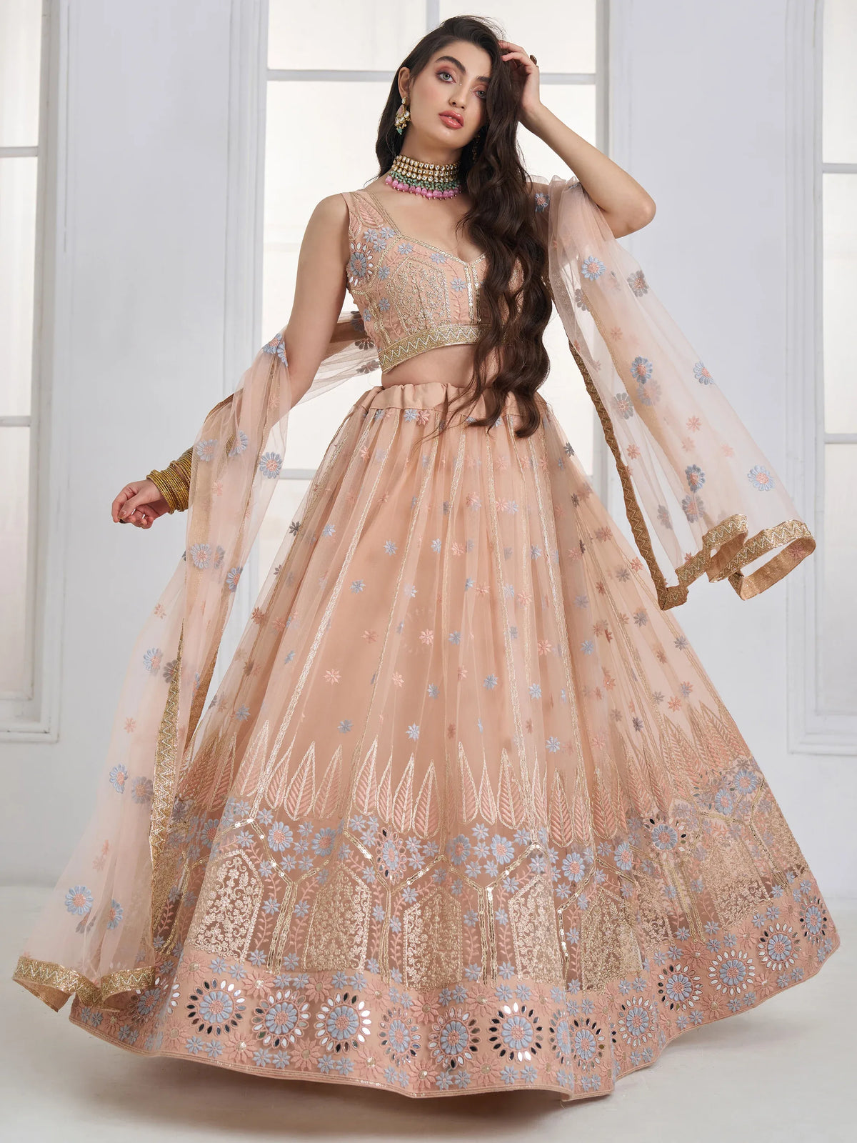 Lovable Peach Floral Embroidered Net Engagement Wear Lehenga Choli