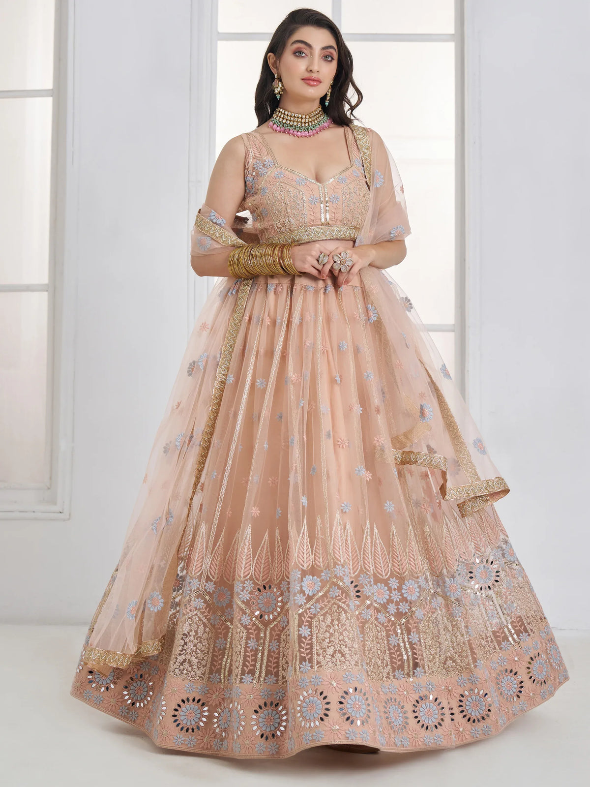 Lovable Peach Floral Embroidered Net Engagement Wear Lehenga Choli