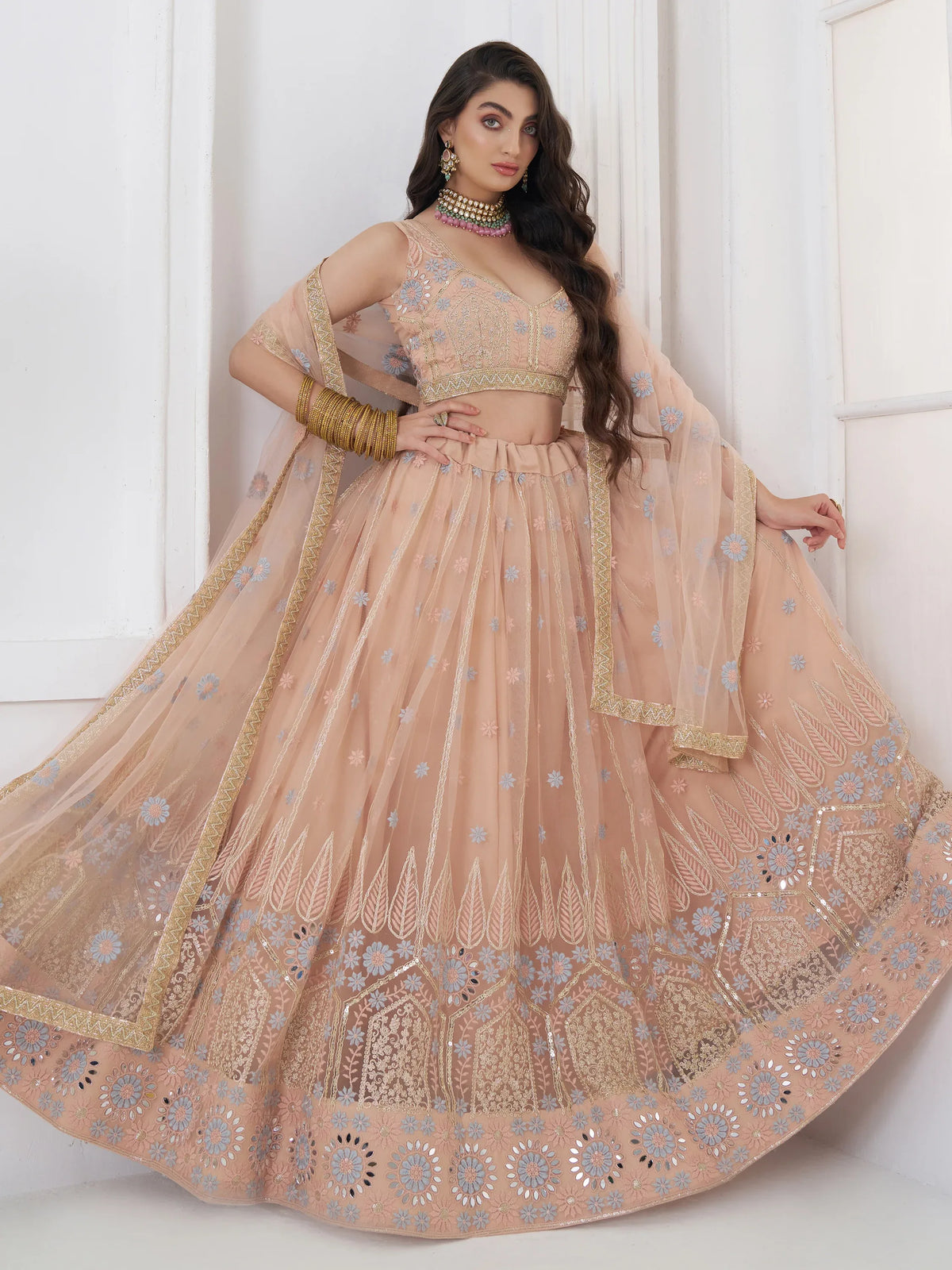 Lovable Peach Floral Embroidered Net Engagement Wear Lehenga Choli