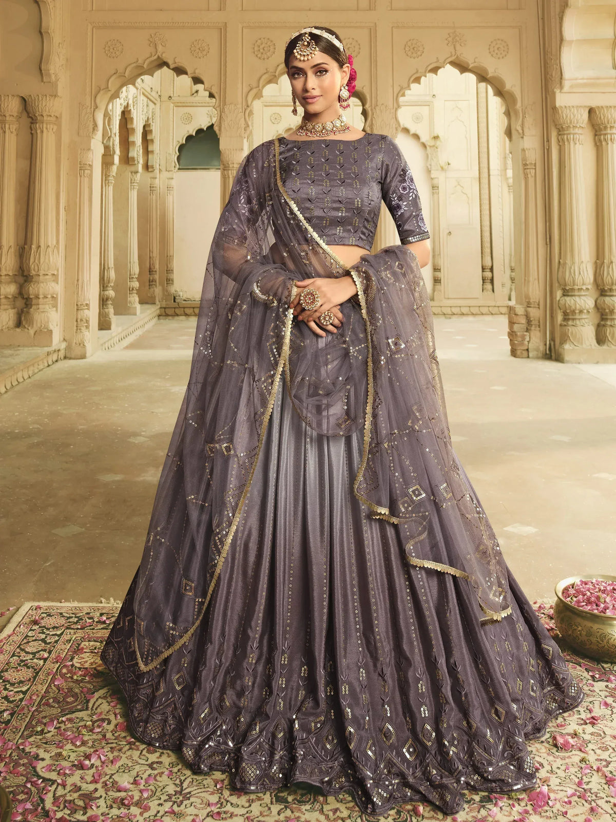 Elegant grey lehenga choli with gold embroidery, perfect for Indian weddings and festive occasions.