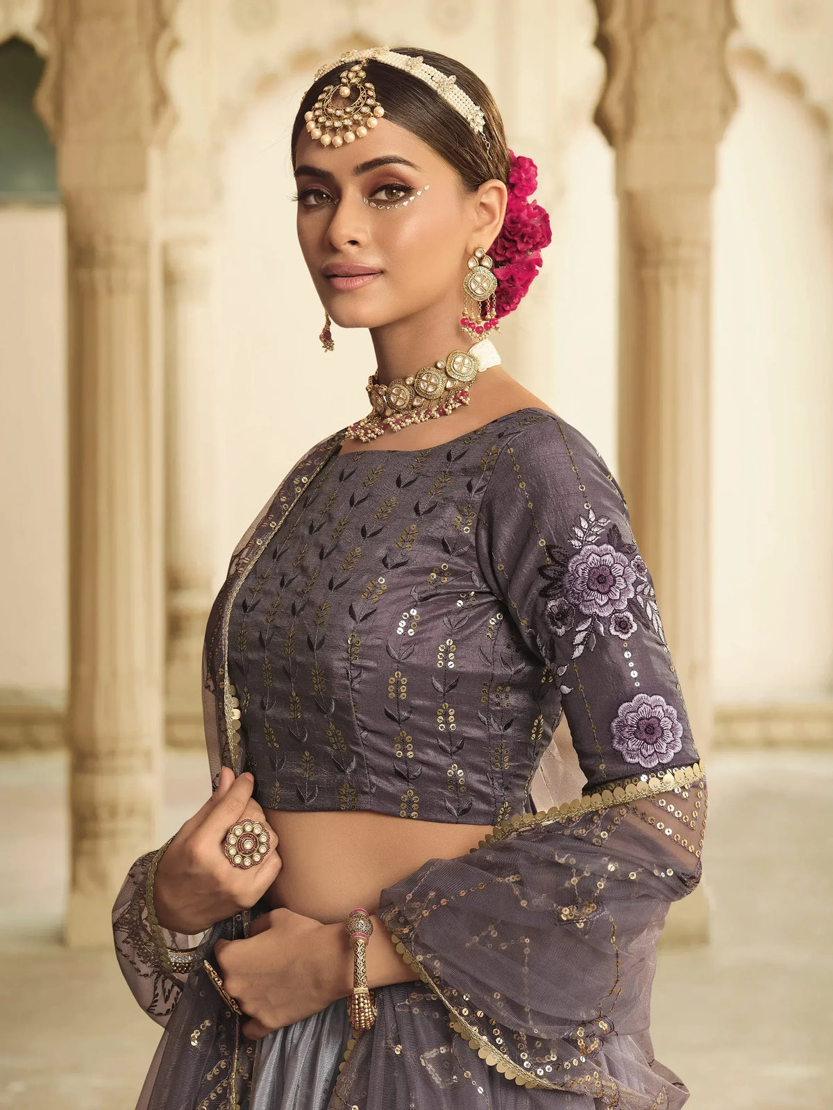 Elegant grey lehenga choli with floral embroidery and gold sequins, perfect for Indian ethnic wear occasions.