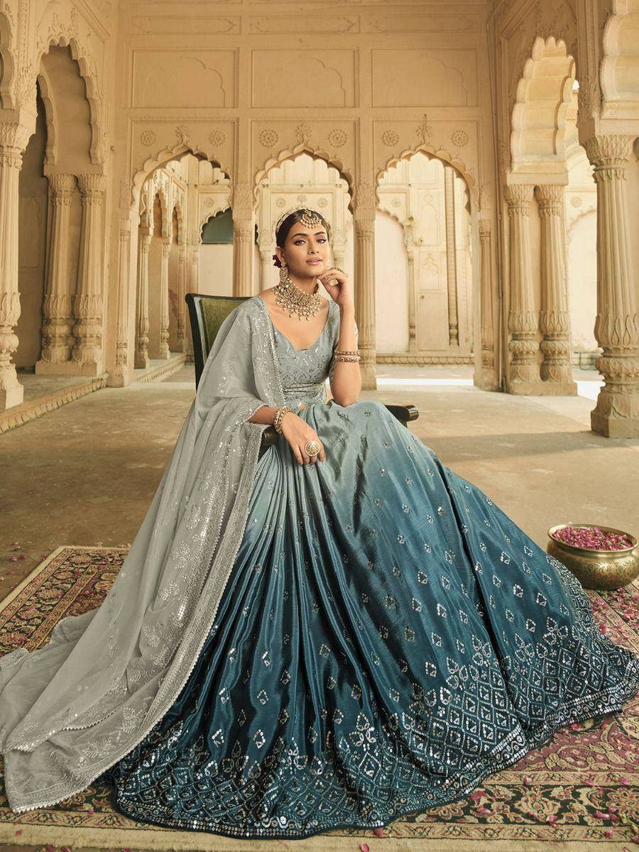 Elegant teal lehenga choli with silver embroidery, perfect for Indian weddings and festive occasions.