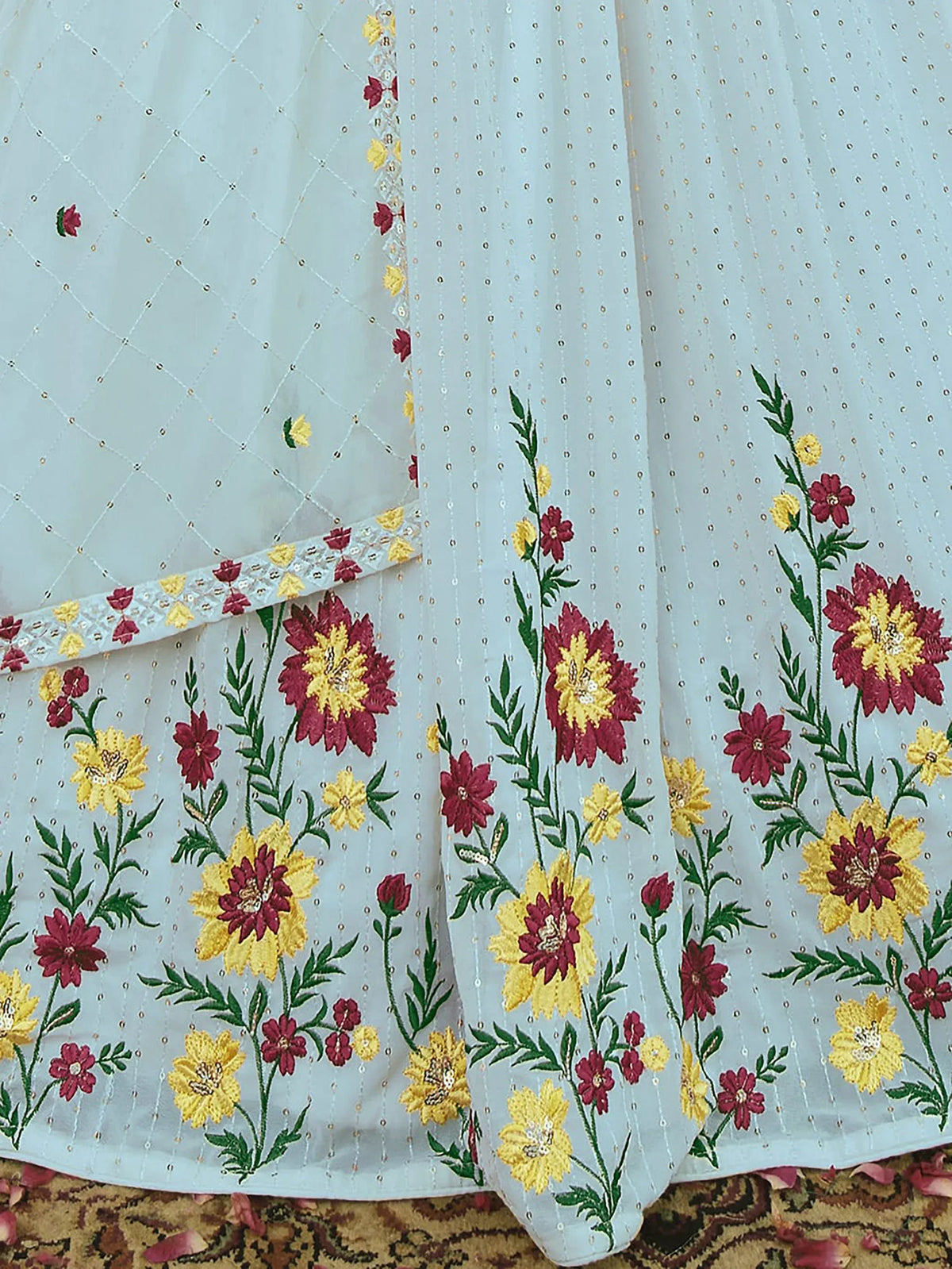 White ethnic gown with red and yellow floral embroidery and sequin detailing