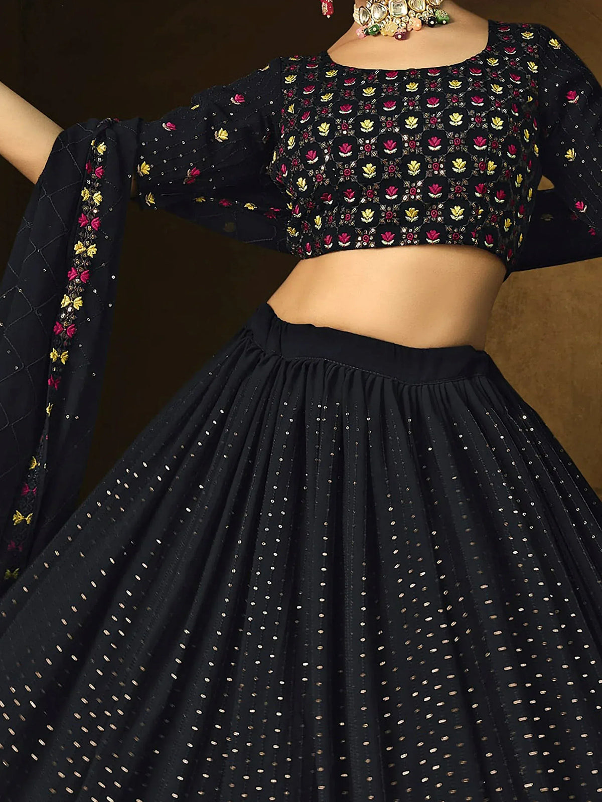 Black embroidered lehenga choli with floral motifs and sequin detailing, perfect for Indian ethnic wear.