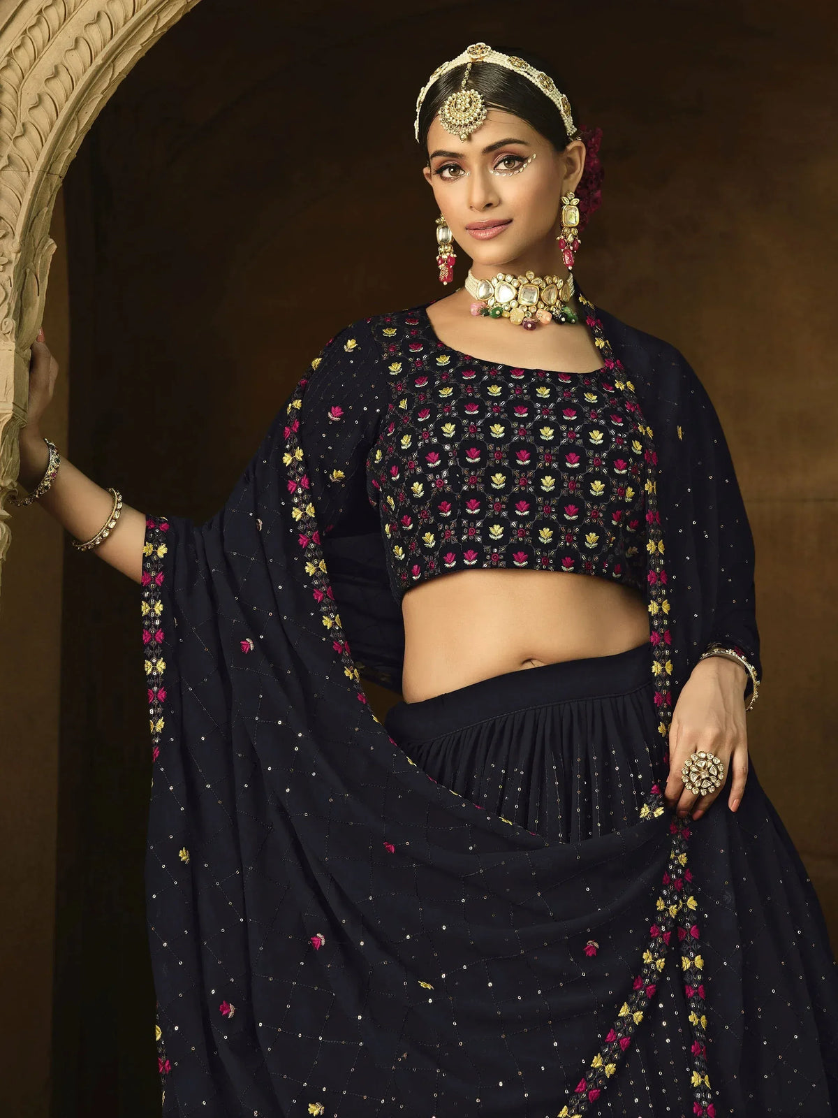 Navy blue embroidered lehenga choli with floral motifs, traditional Indian ethnic wear for women