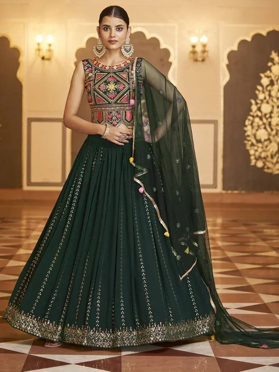 Emerald green embroidered lehenga choli with floral motifs and sheer dupatta, perfect for Indian ethnic occasions
