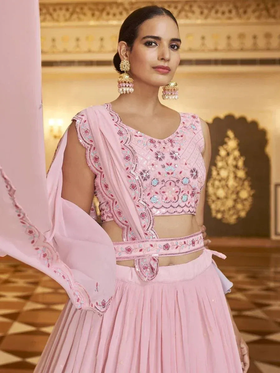Pink embroidered lehenga choli with floral motifs and matching dupatta, ideal for Indian ethnic occasions