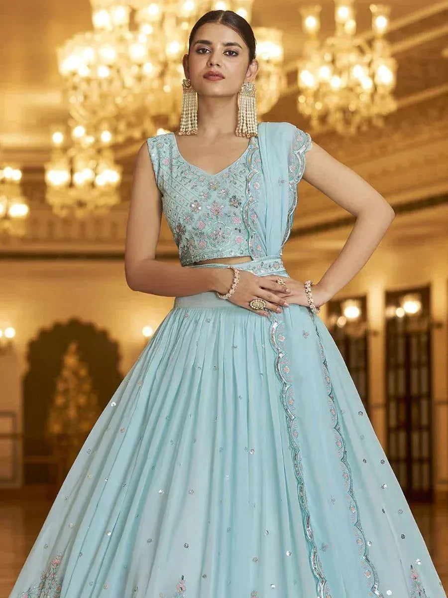 Light blue designer lehenga choli with floral embroidery, perfect for Indian weddings and festive occasions.