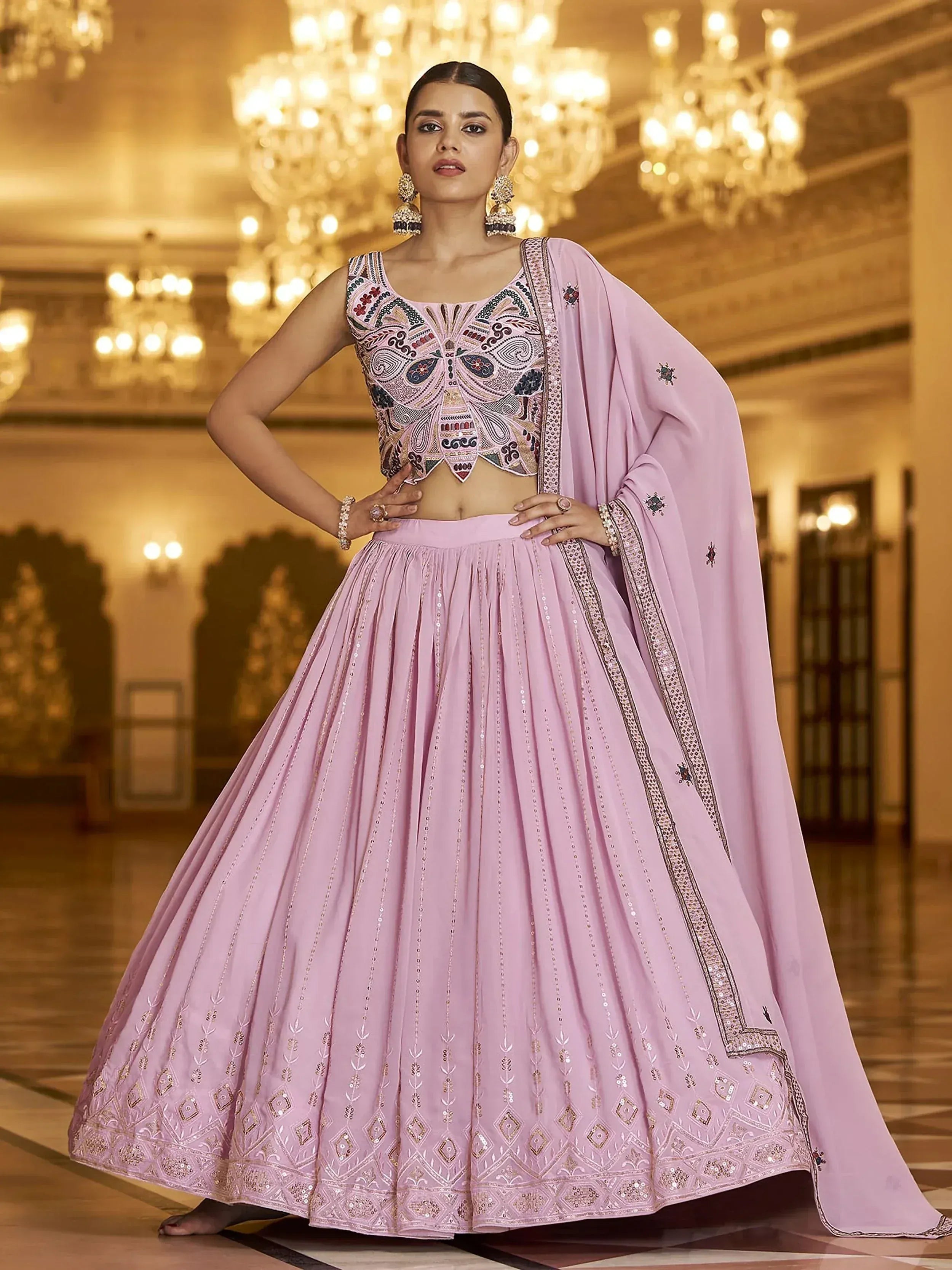Pink embroidered lehenga choli with detailed blouse and dupatta, perfect for Indian weddings and festive occasions.