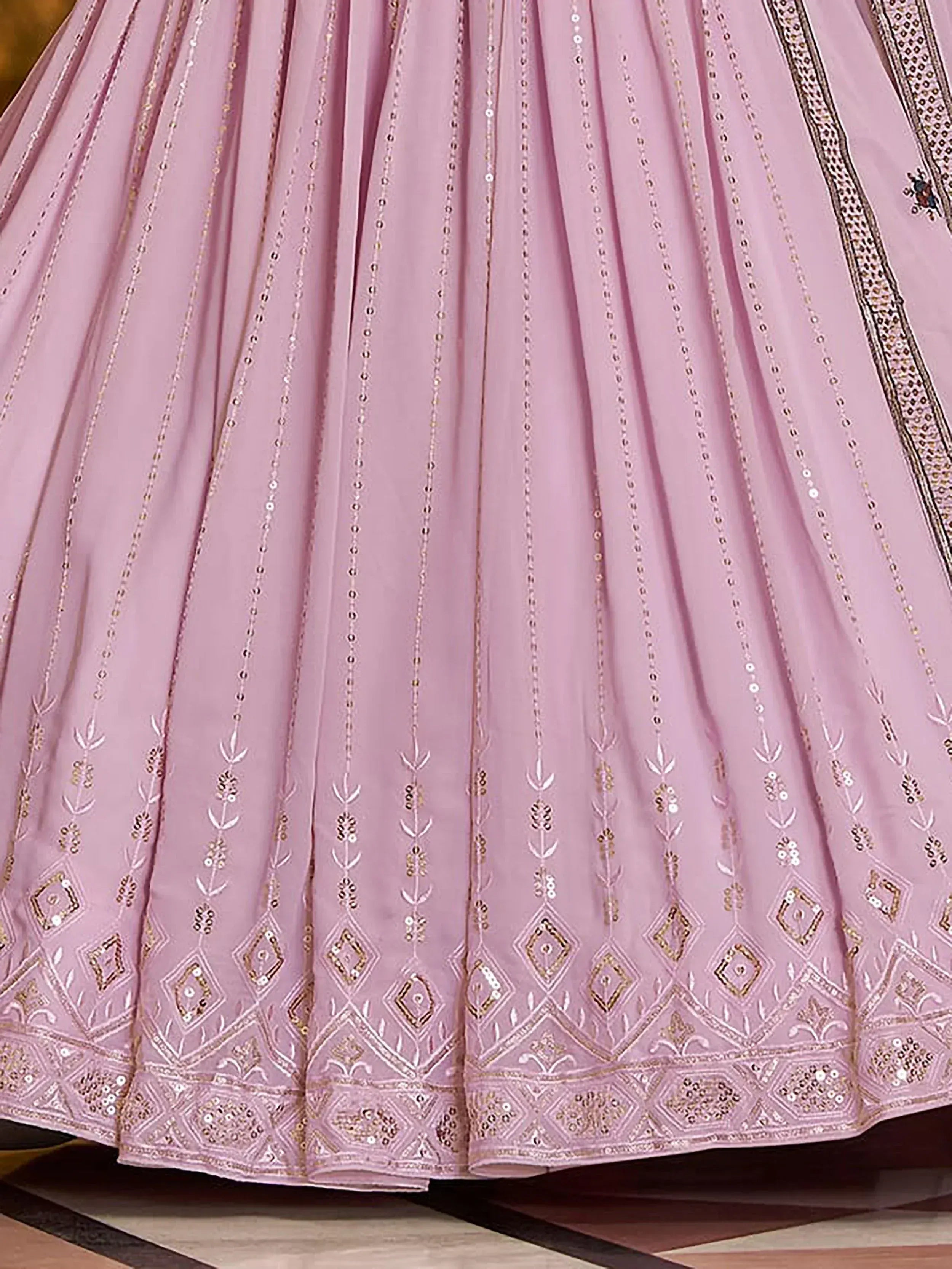 Pink designer lehenga with gold embroidery and sequin detailing for Indian ethnic wear