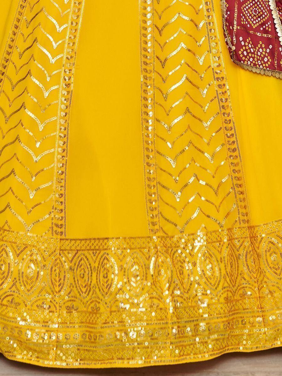 Yellow ethnic gown with gold sequin chevron and border embroidery, perfect for Indian festive wear